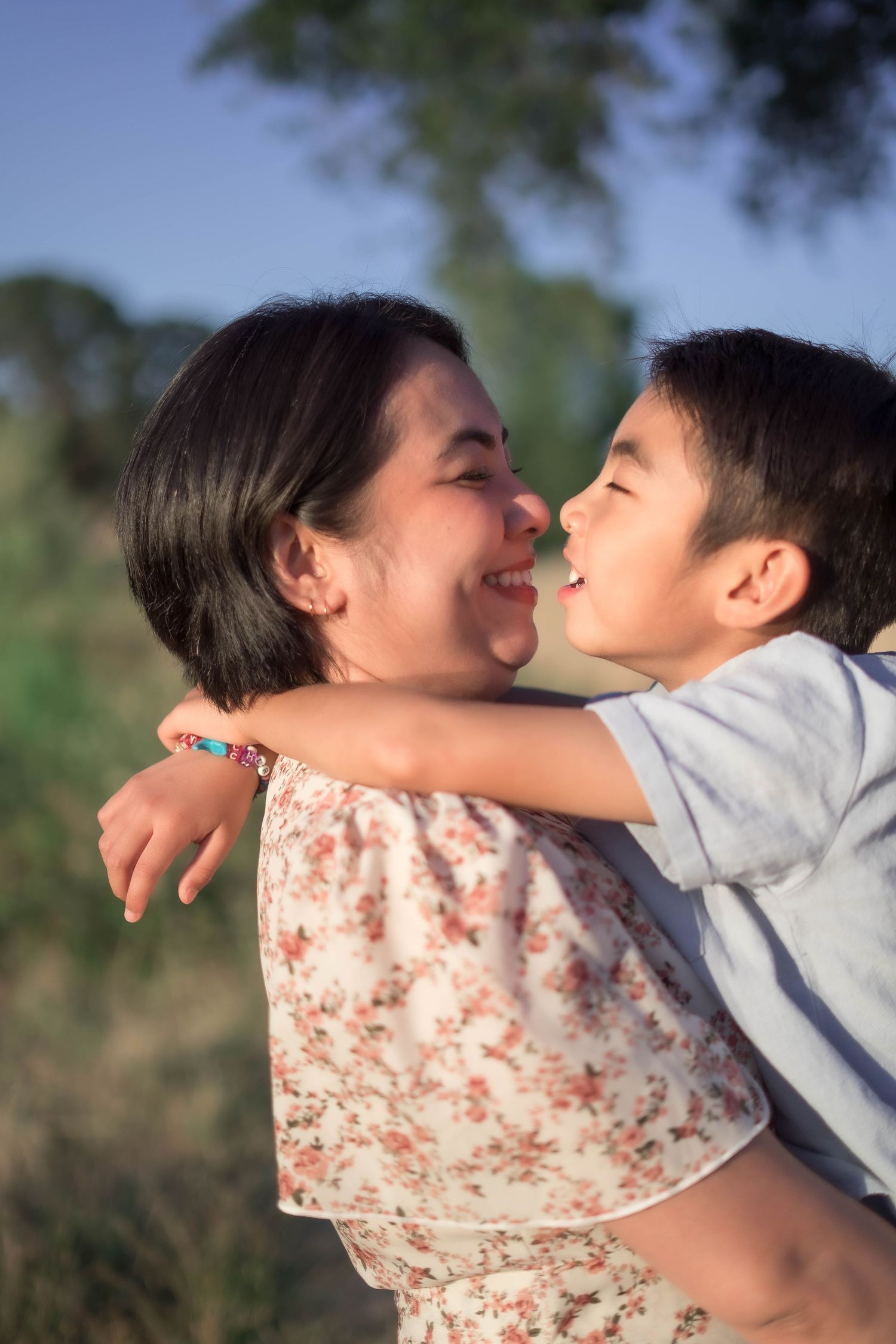 A loving embrace captured in a series of intimate outdoor portraits.