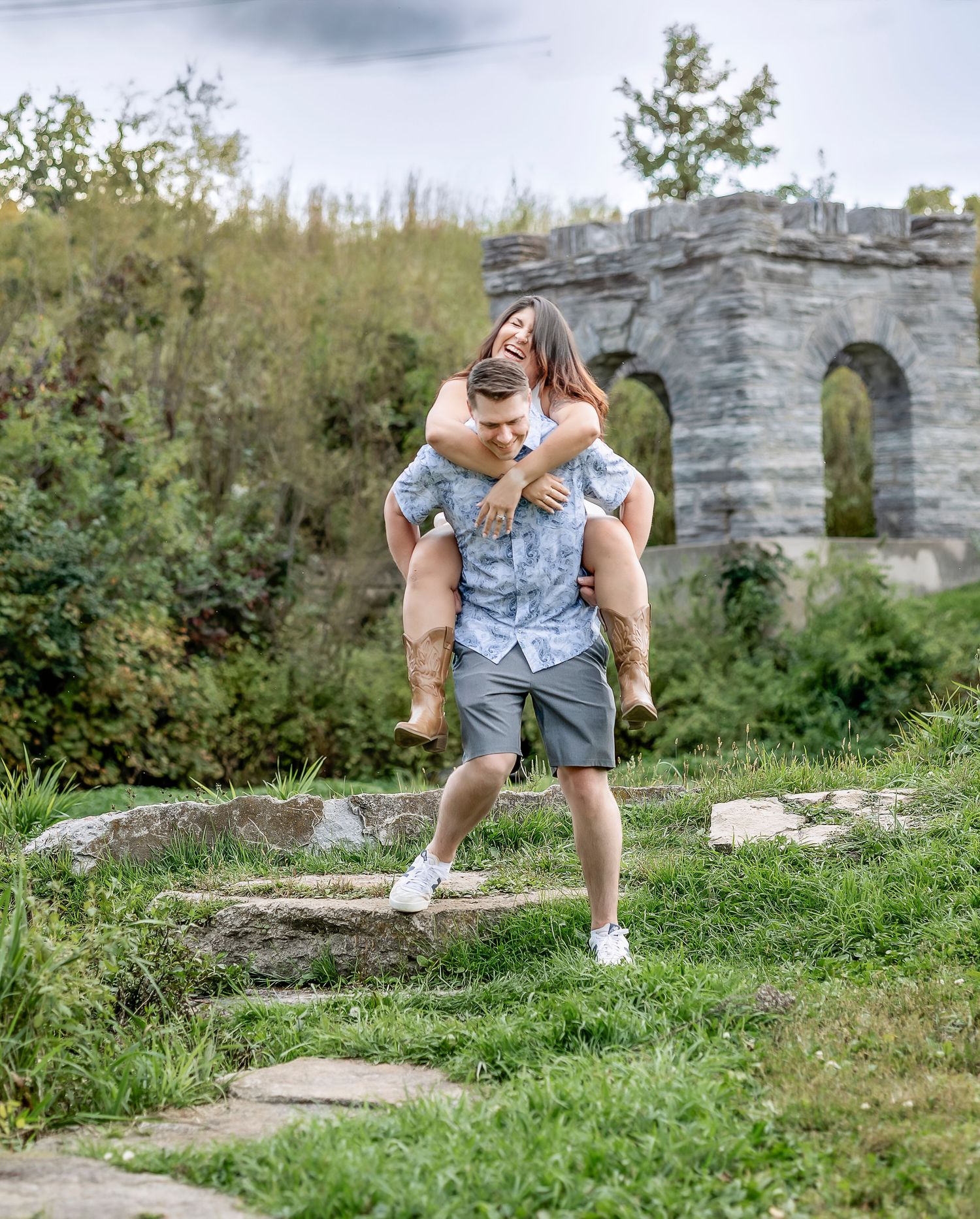 Woman laughing while man is giving her a piggyback ride
