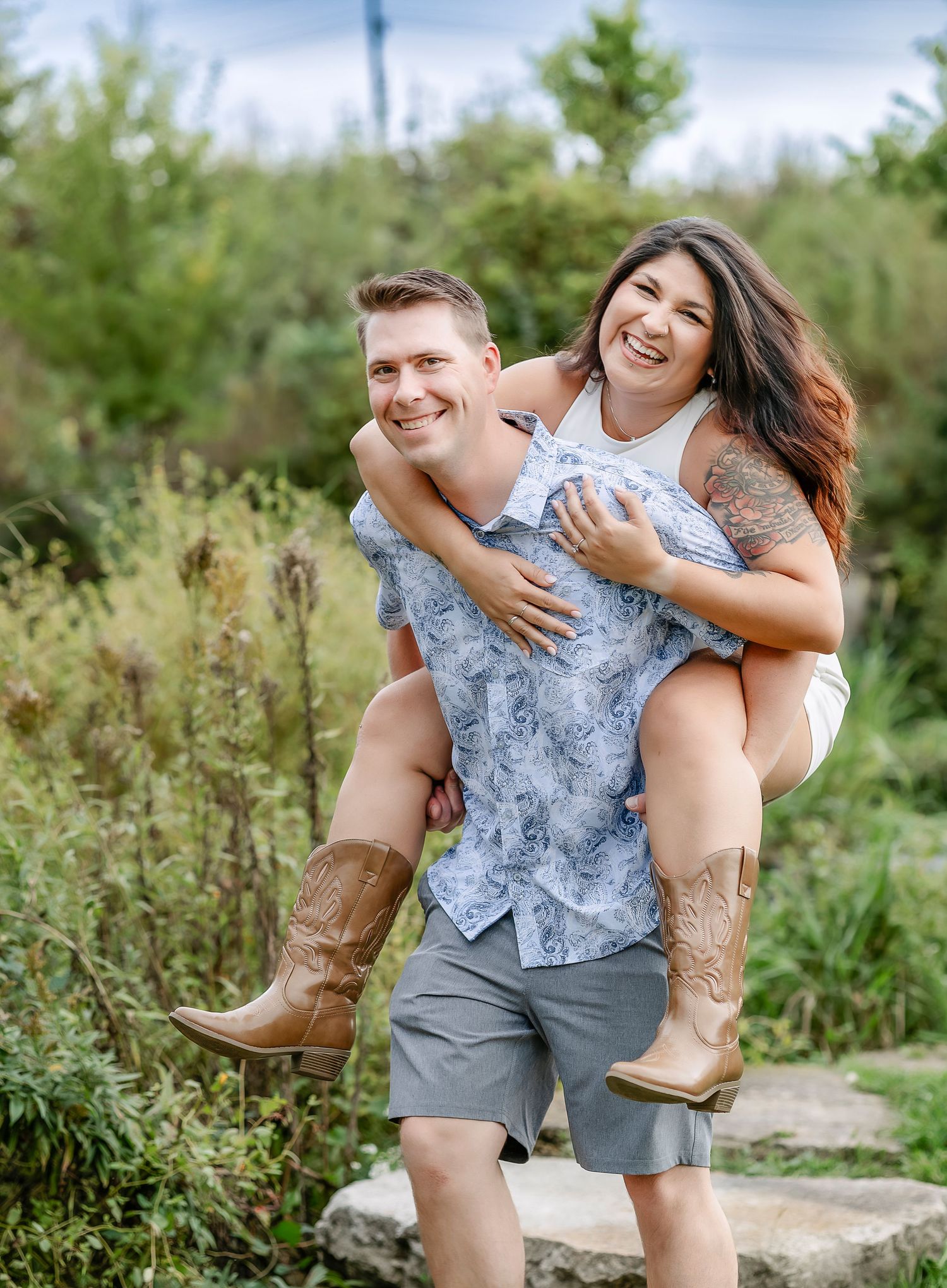 Couple smiling together while woman gets a piggyback ride