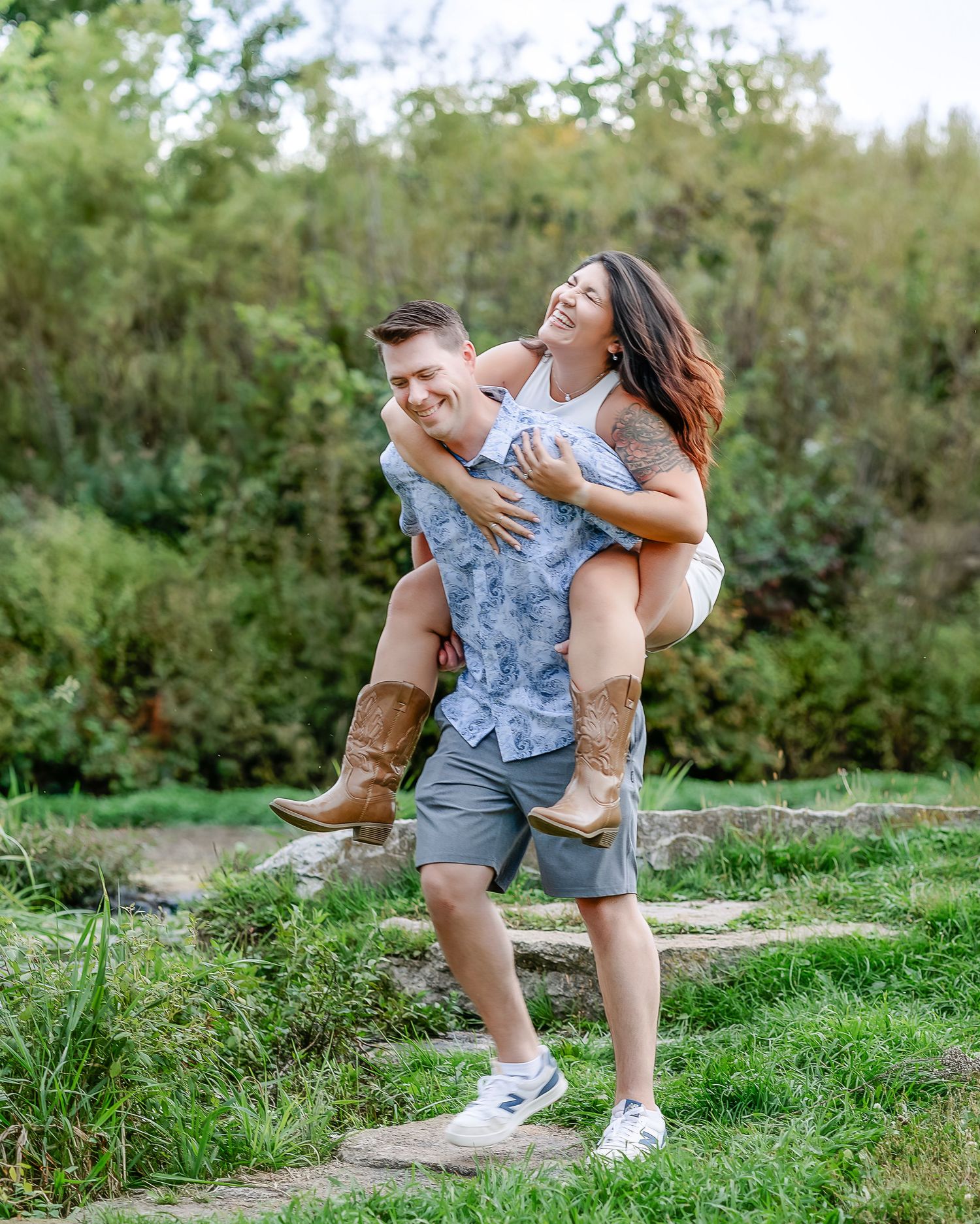 Woman laughing while getting a piggyback ride from a man