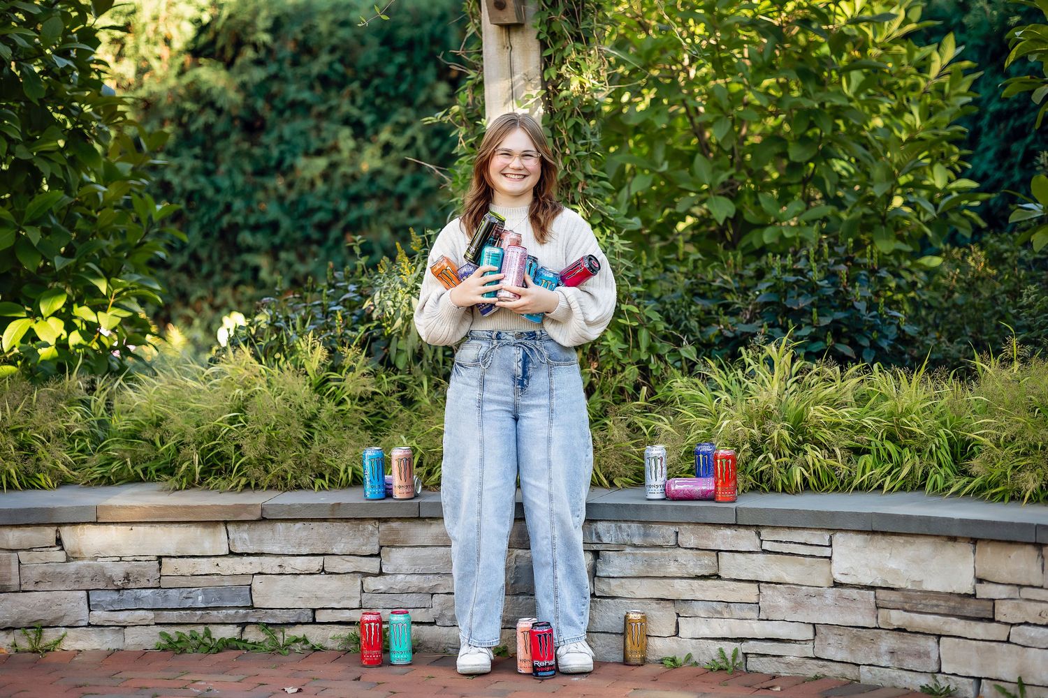 Senior girl hoarding Monster Energy drinks