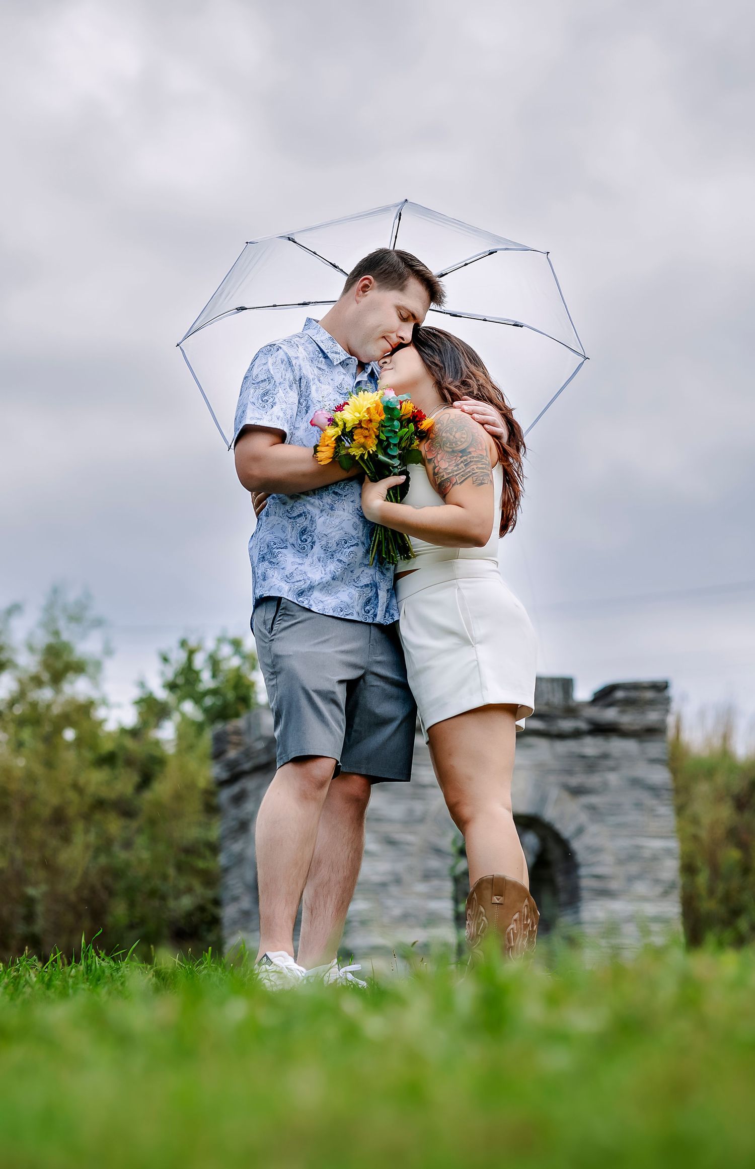 Couple with flowers and umbrella