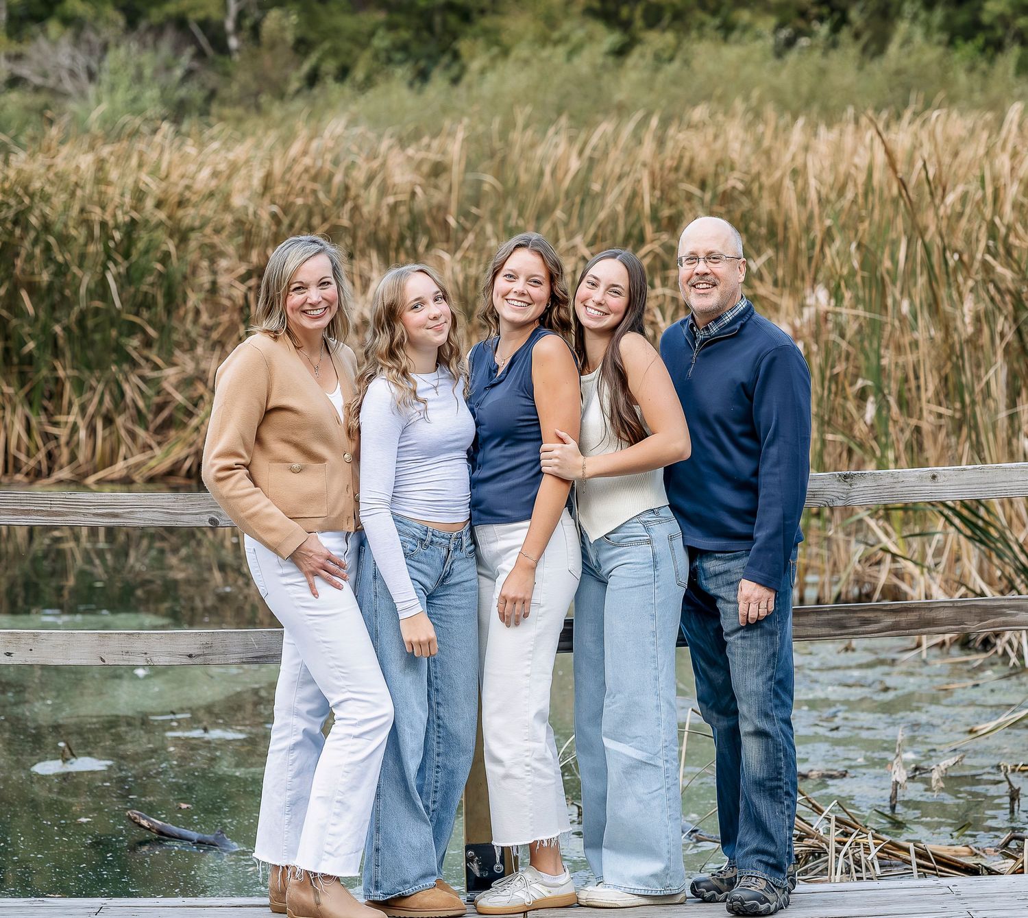 Family of five next to the water