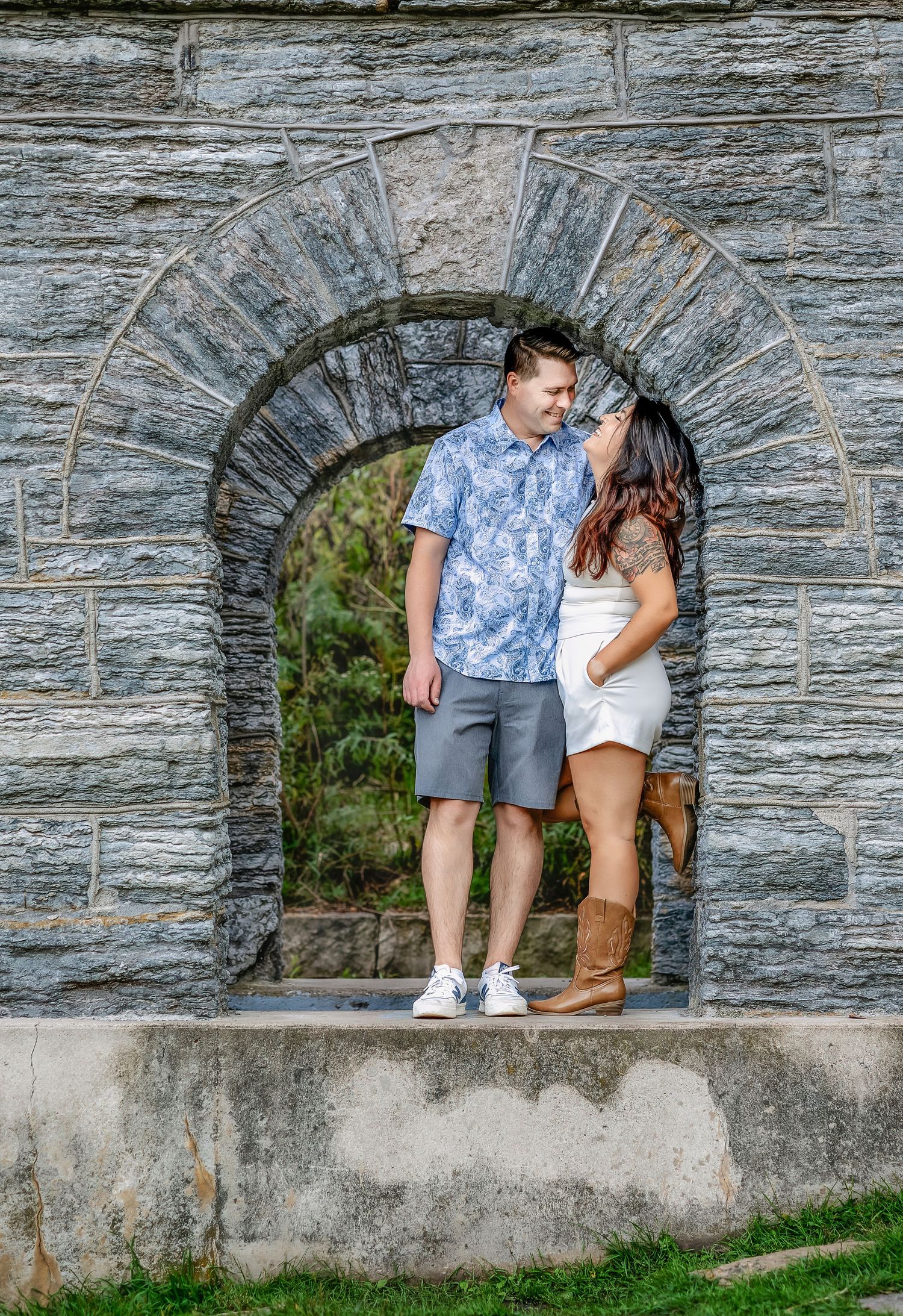 Woman and man standing in an arch