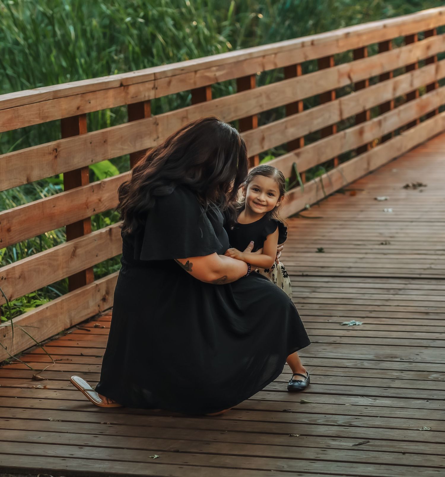 Mother and daughter kneeling together