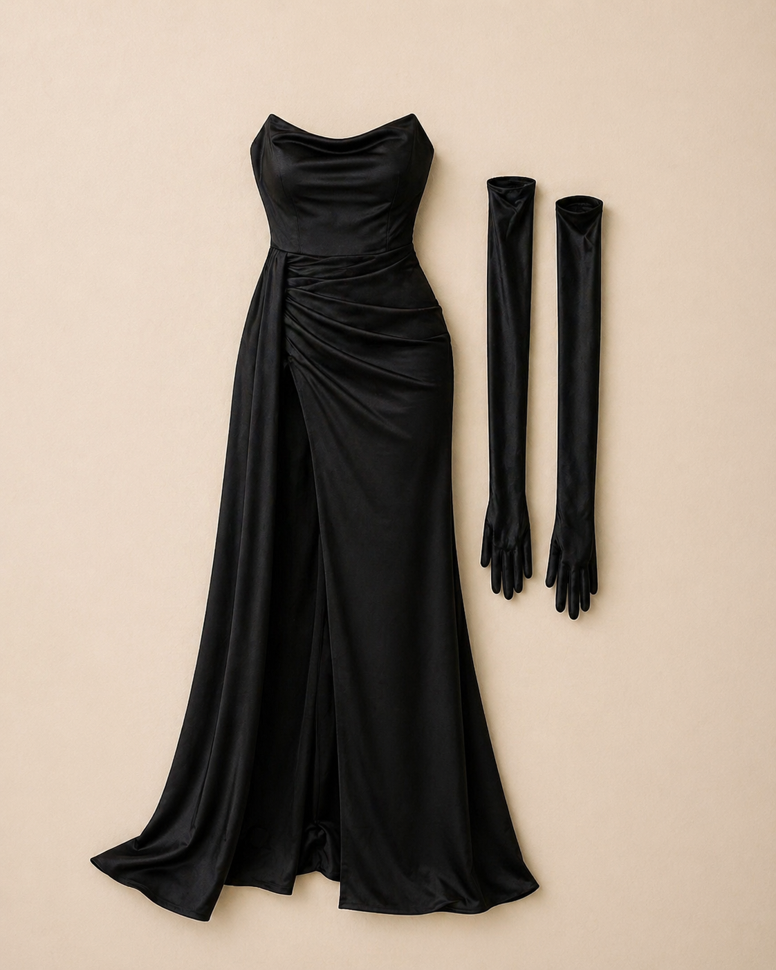 Elegant black satin strapless gown with ruched detail and a thigh-high slit, paired with long black satin gloves.