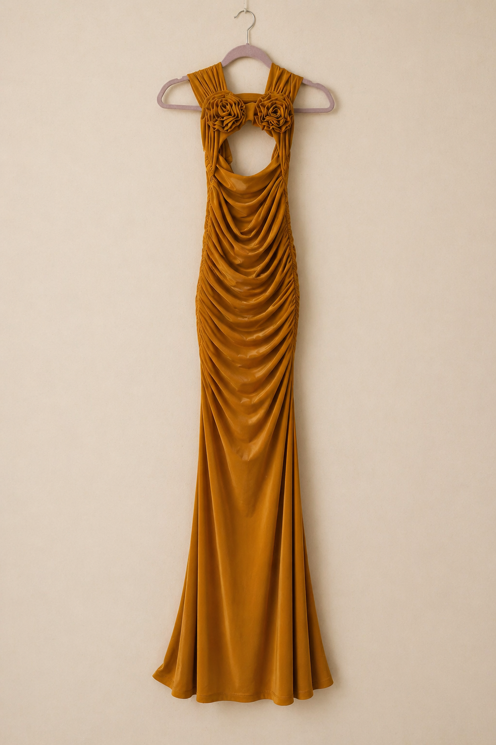 Elegant mustard ruched maxi gown with floral detail and keyhole cutout.