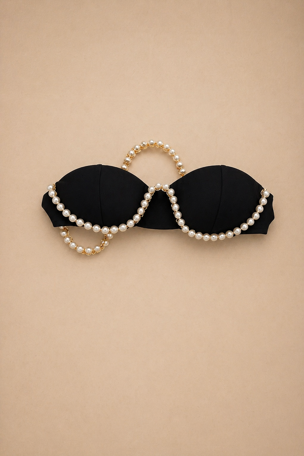 Black strapless bikini top adorned with elegant pearl and gold chain embellishments.