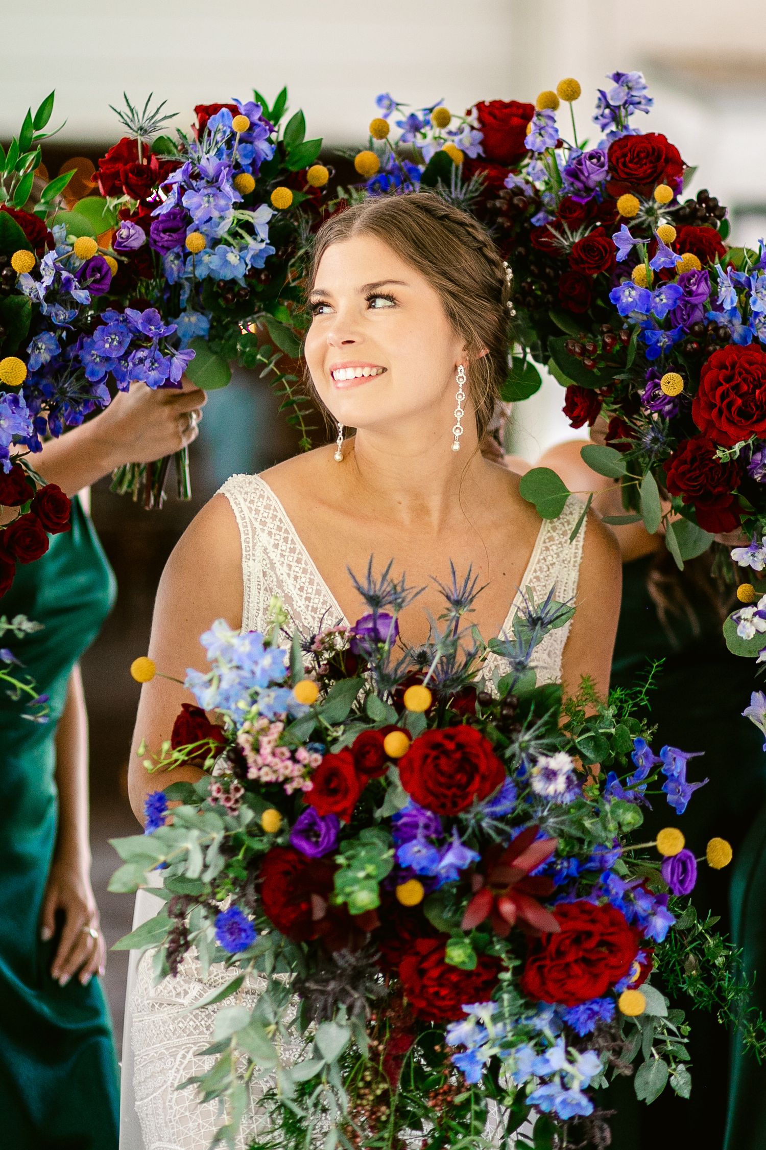 Stunning bridal portrait with colorful wildflower and rose bouquet.