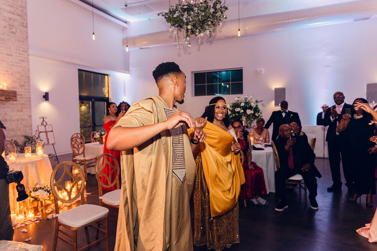 Modern wedding reception venue with ambient lighting and minimalist decor.
