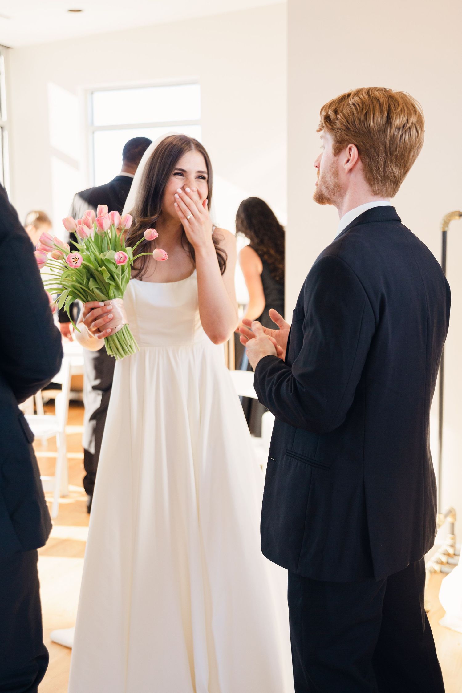 A sweet moment between a couple with tulips during their wedding celebration.