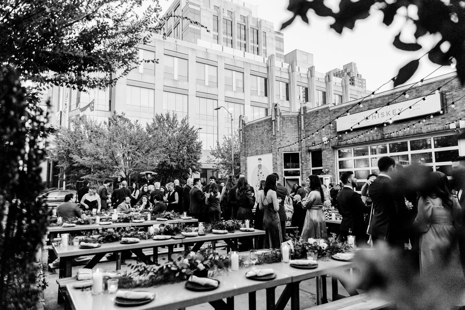 A series of black and white photographs showing a bustling city street scene with storefronts and pedestrians.