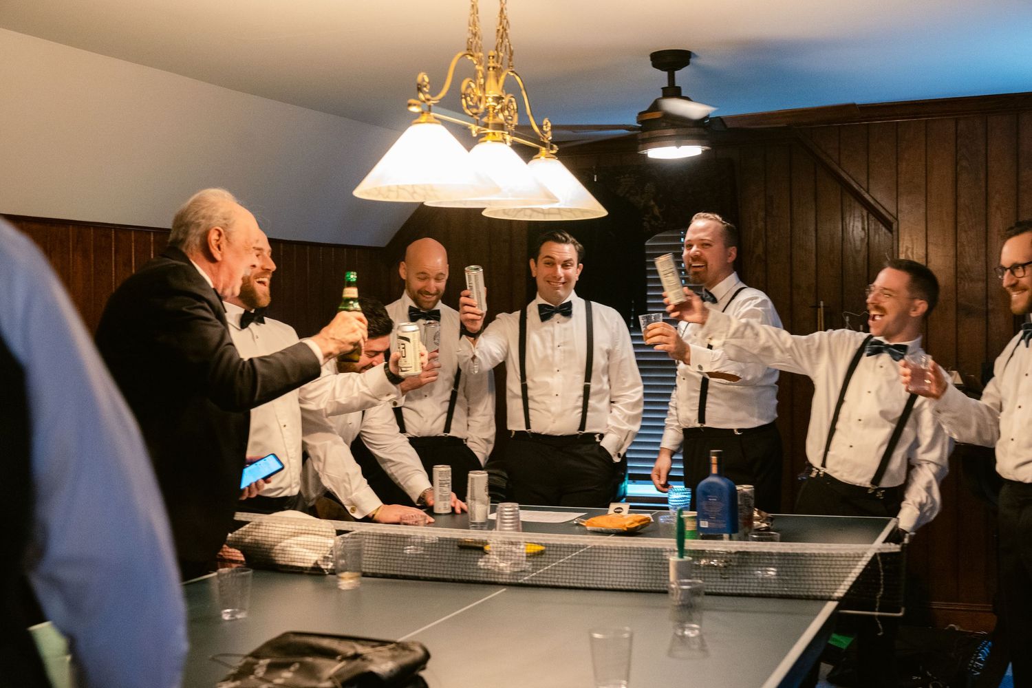 A collection of candid moments showing people gathered in a dimly lit room with suspenders and formal attire.