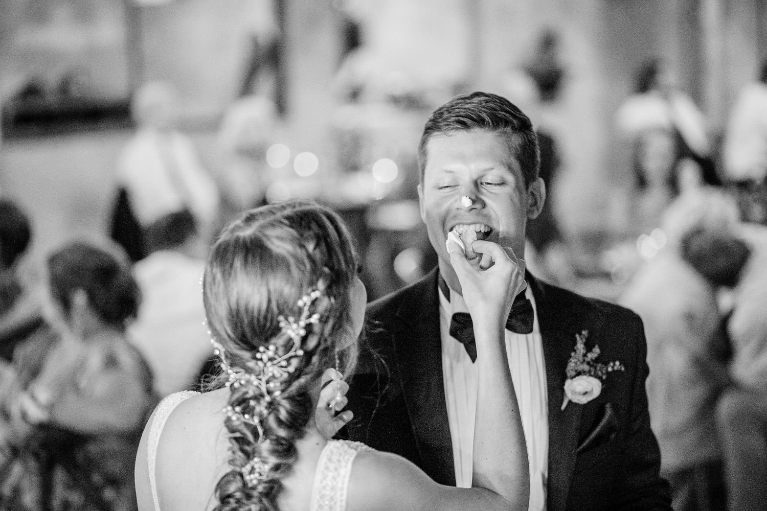 A candid moment of laughter and joy between a couple during their wedding celebration.