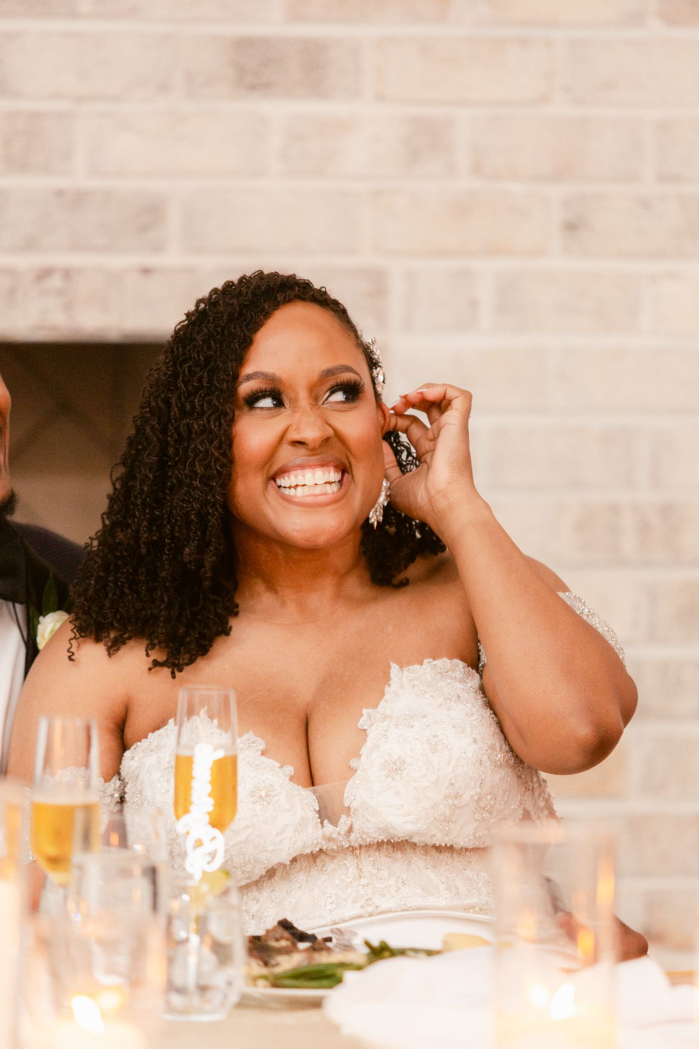 Candid reception moments showing laughter and joy at the dining table.