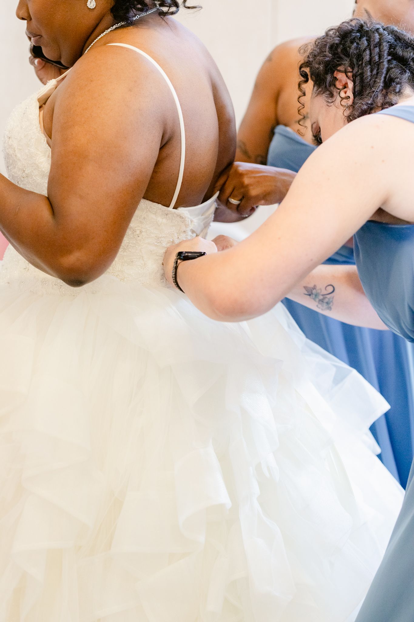 Documentary wedding photographer captures candid bridal getting ready moment in Greensboro NC