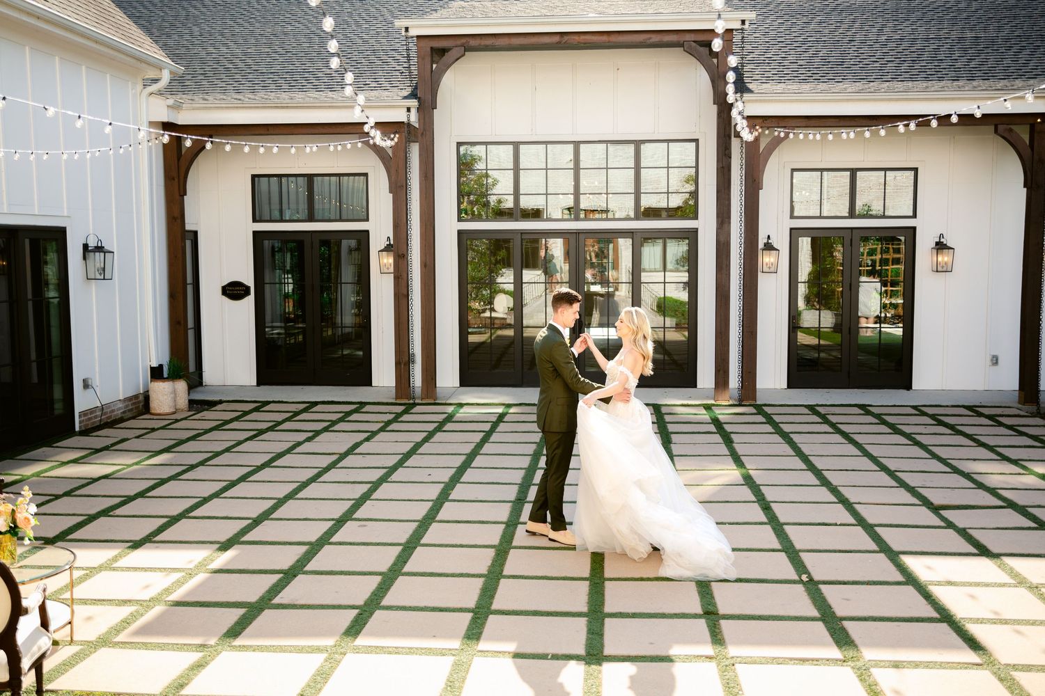 A panoramic collage showing a wedding couple dancing in an elegant white ballroom with green striped floors.