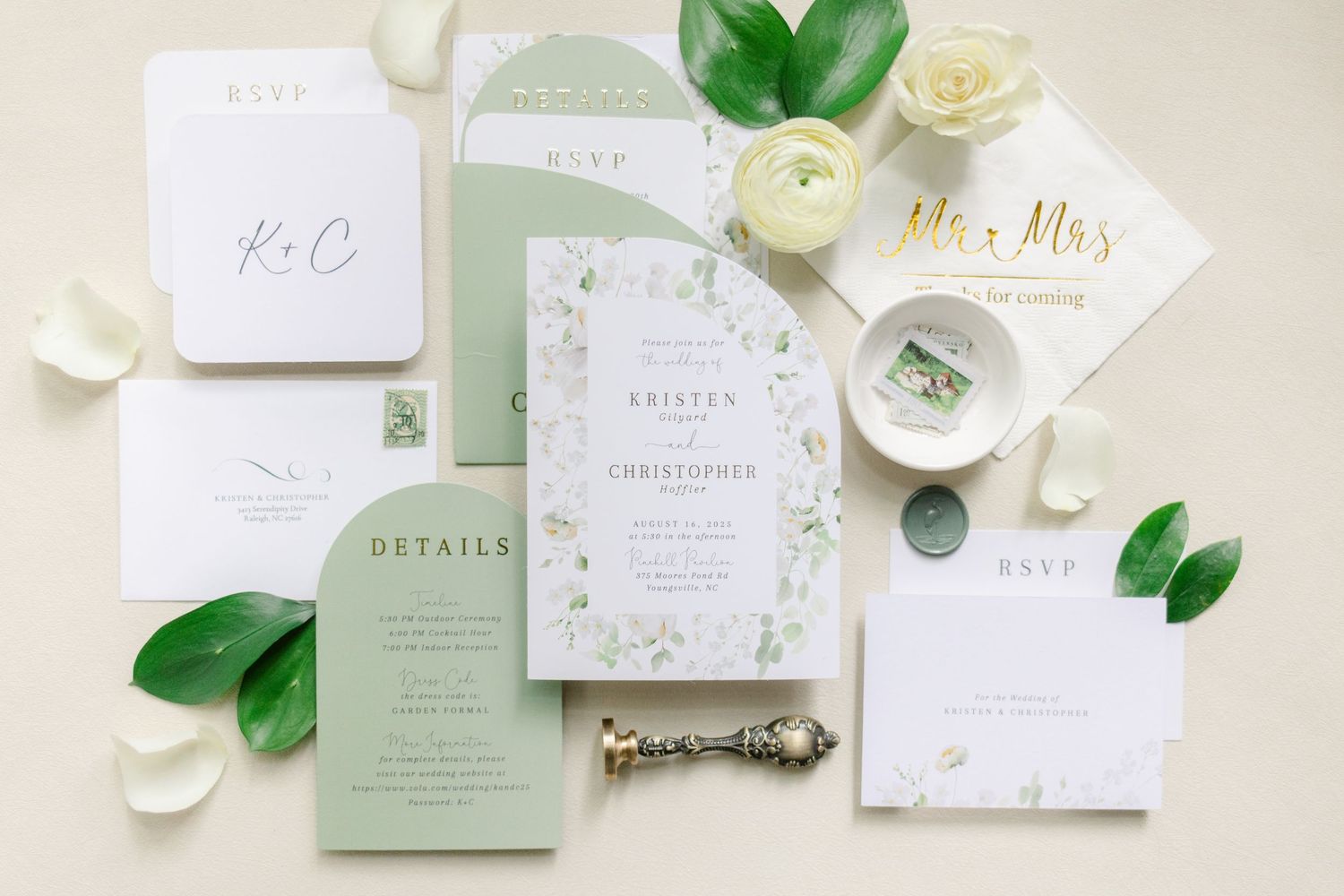 Wedding invitation suite with sage green and white color scheme featuring floral designs and elegant typography.