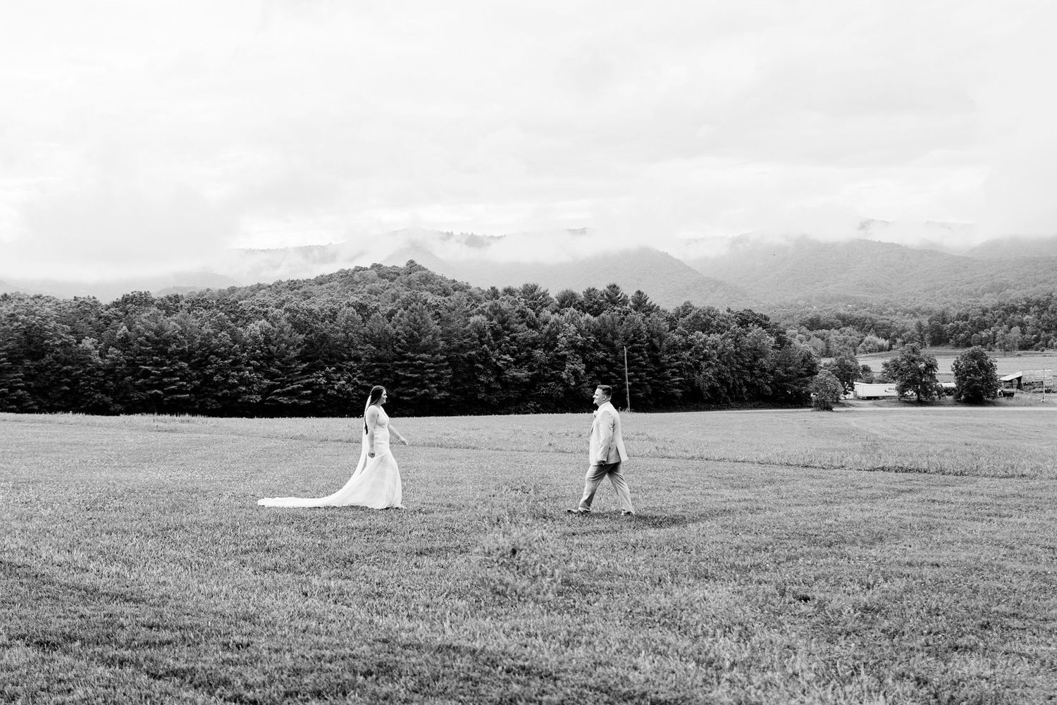 A series of black and white landscape photographs showing rolling hills and distant mountains in a panoramic view.