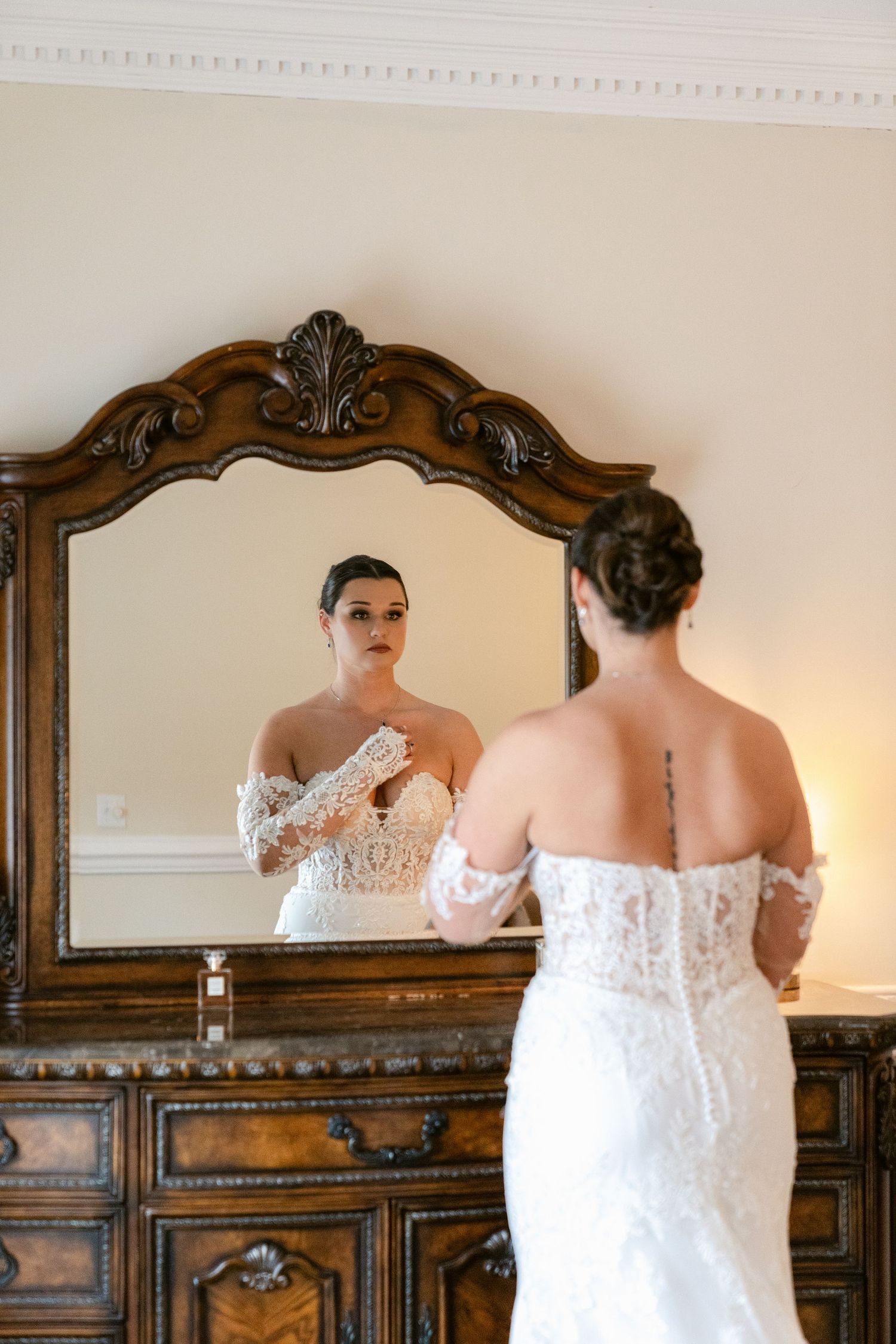 Artistic wedding photography series showing reflections of a bride in an ornate wooden framed mirror.