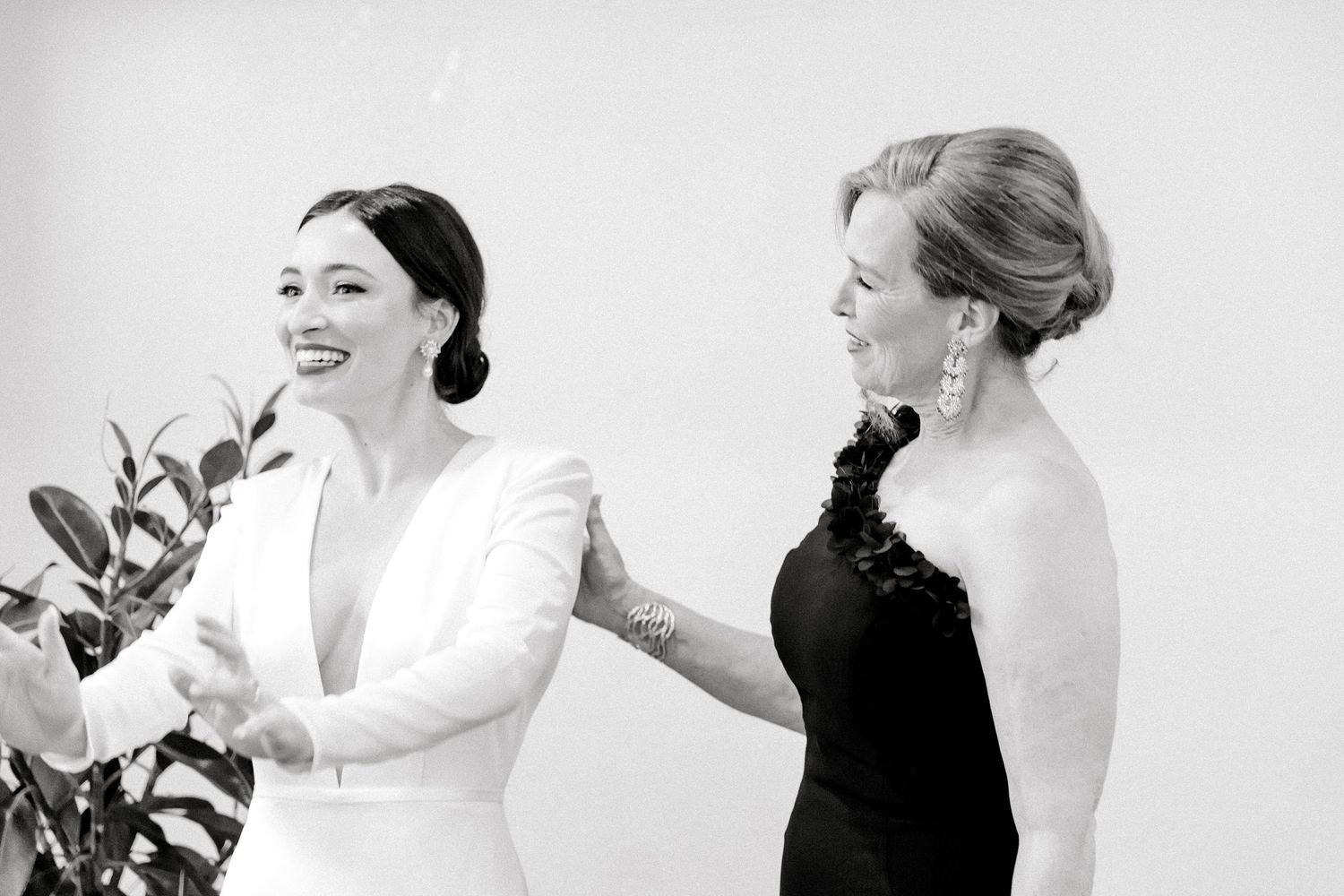 Black and white wedding photos showing intimate moments between a couple during their special day.