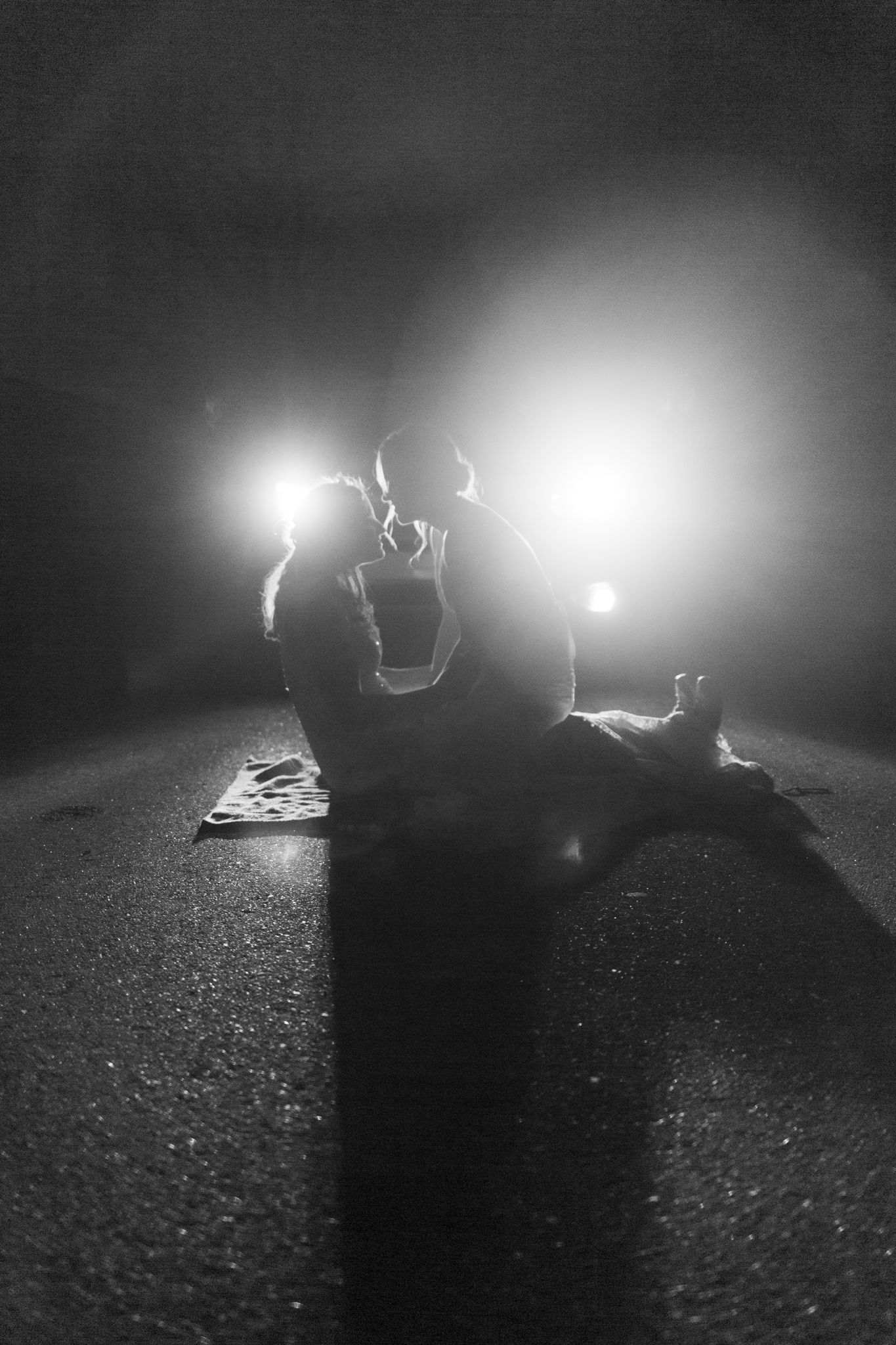 Atmospheric nighttime silhouettes with dramatic backlighting creating a romantic mood.