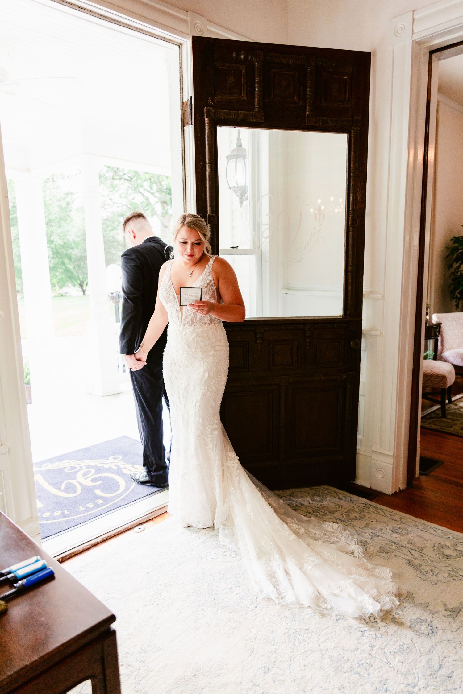 A series of four wedding dress photos showing a bride in a lace gown being fitted and photographed in a sunlit room.