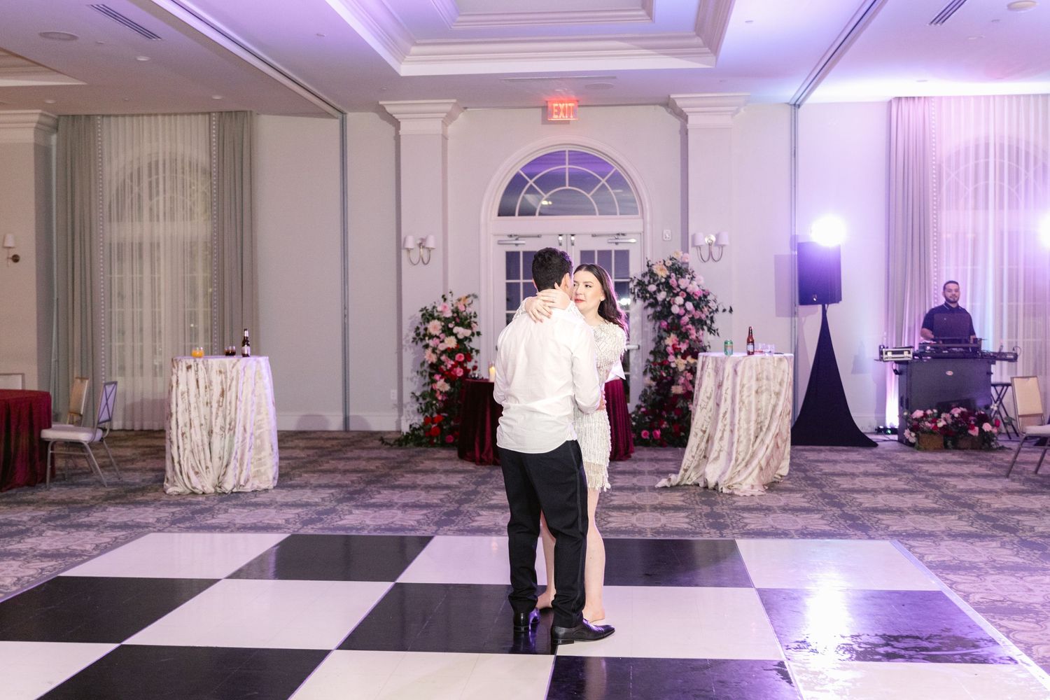 A series of photos showing an elegant white wedding ceremony setup with purple lighting and decorative floral arrangements.