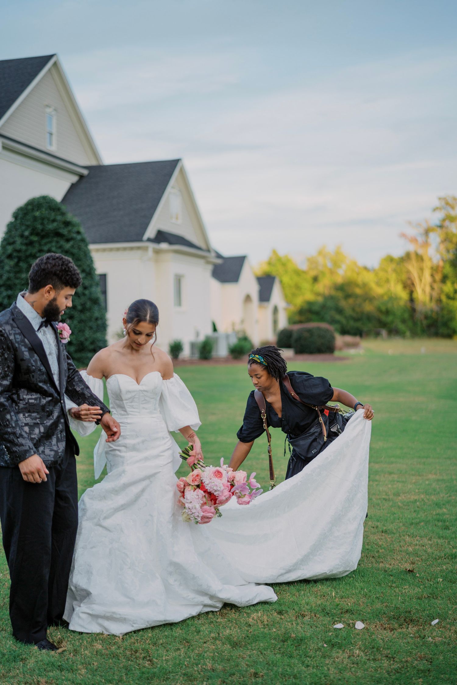 A sequence of wedding photos showing a couple adjusting the bride's white dress on a grassy lawn near a church.