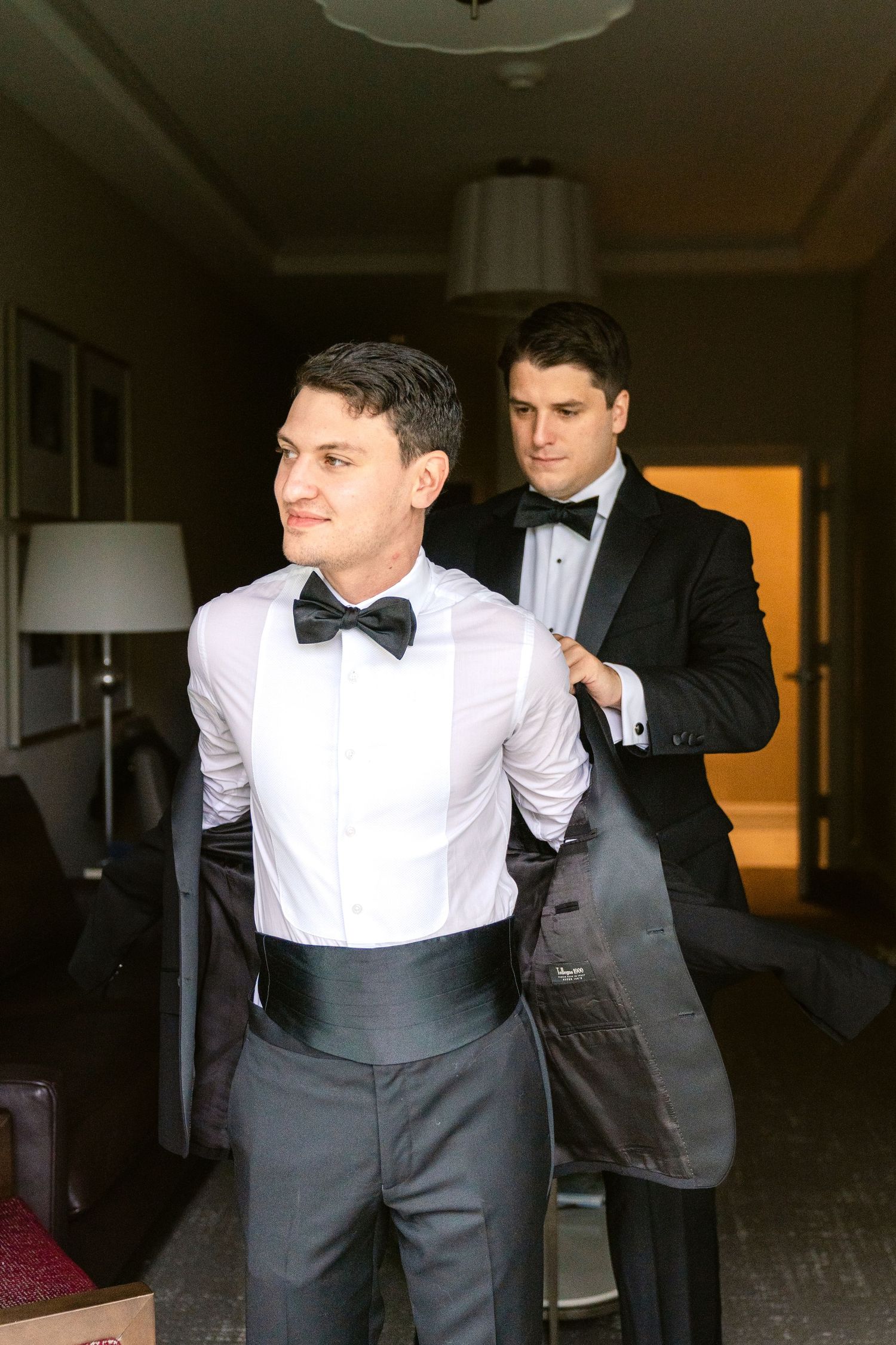Multiple shots of people getting dressed in formal attire with bow ties and white shirts.