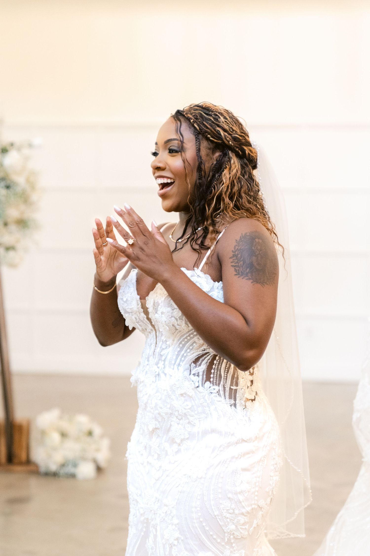 A bride in a white lace wedding dress laughs joyfully in a series of candid photos.