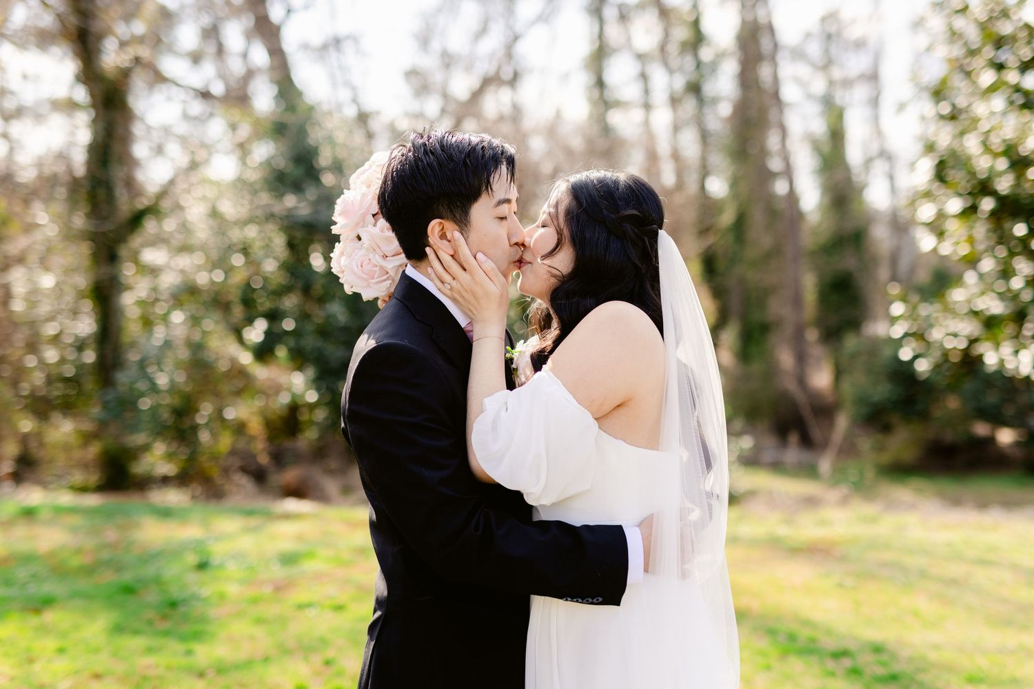A romantic outdoor wedding photo session in a wooded setting.
