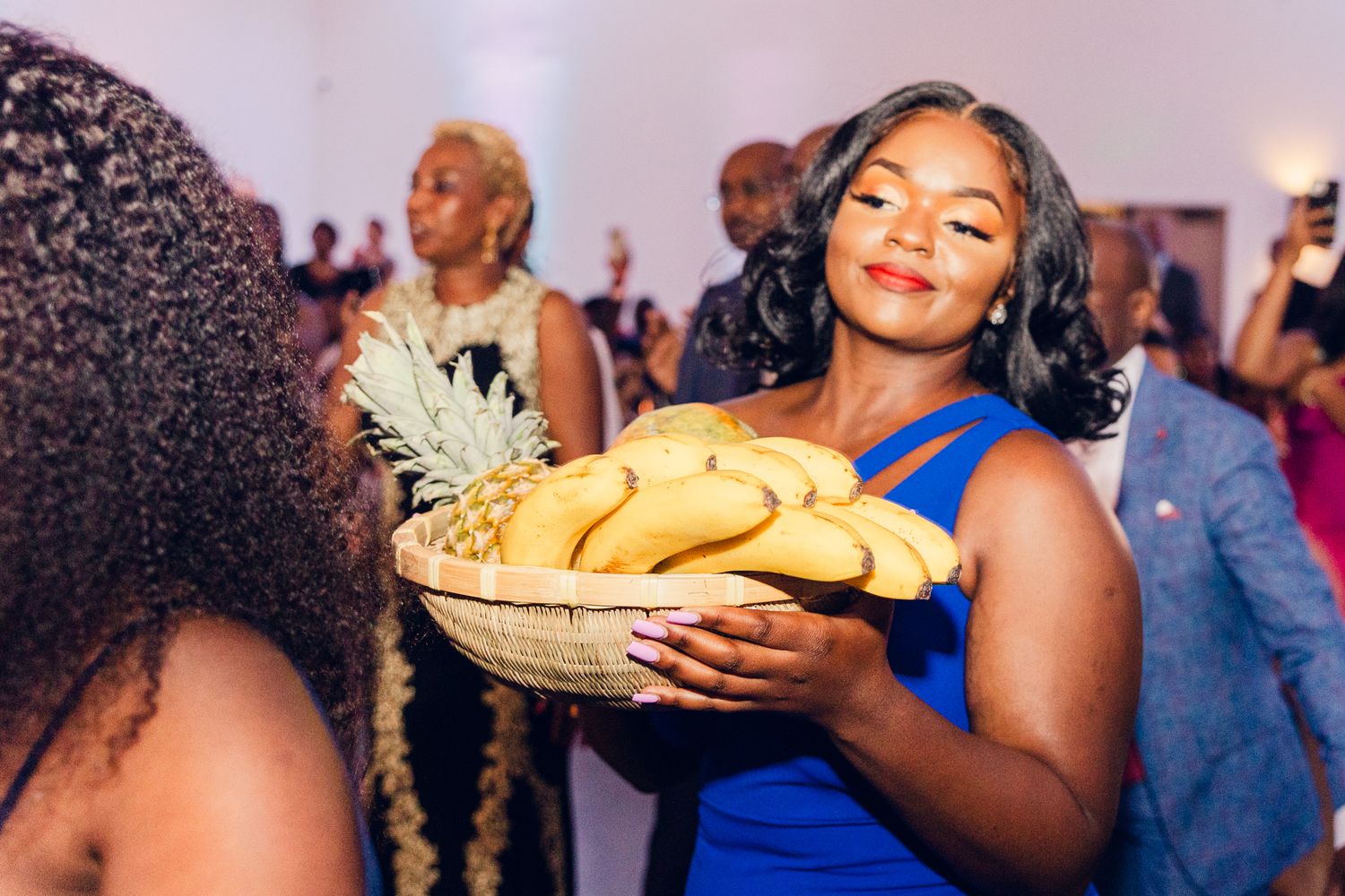 Reception guests enjoying food and festivities in elegant evening attire.