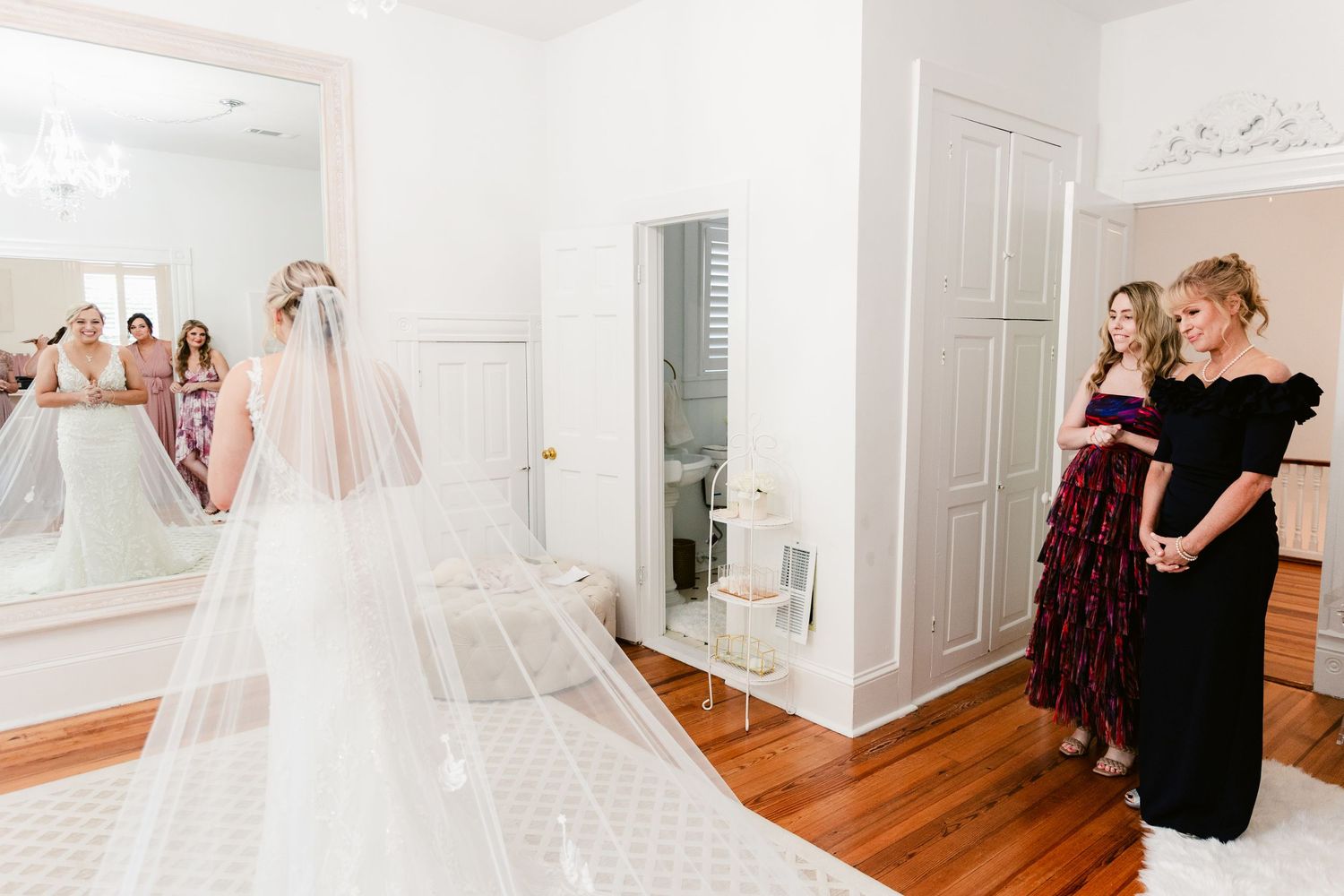A collection of wedding preparation moments showing bridesmaids and a bride getting ready in an elegant white room.