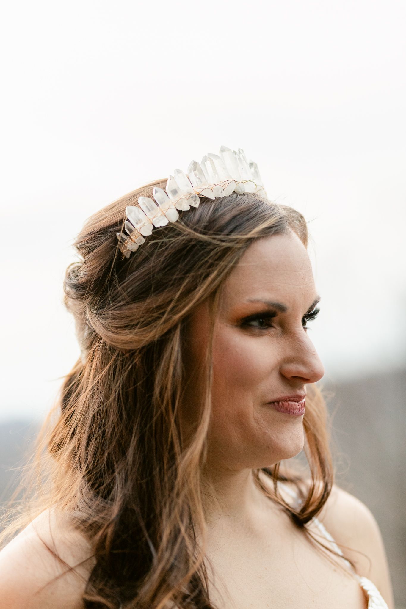 A series of close-up profile shots showing a delicate crystal hair accessory against flowing brown hair.