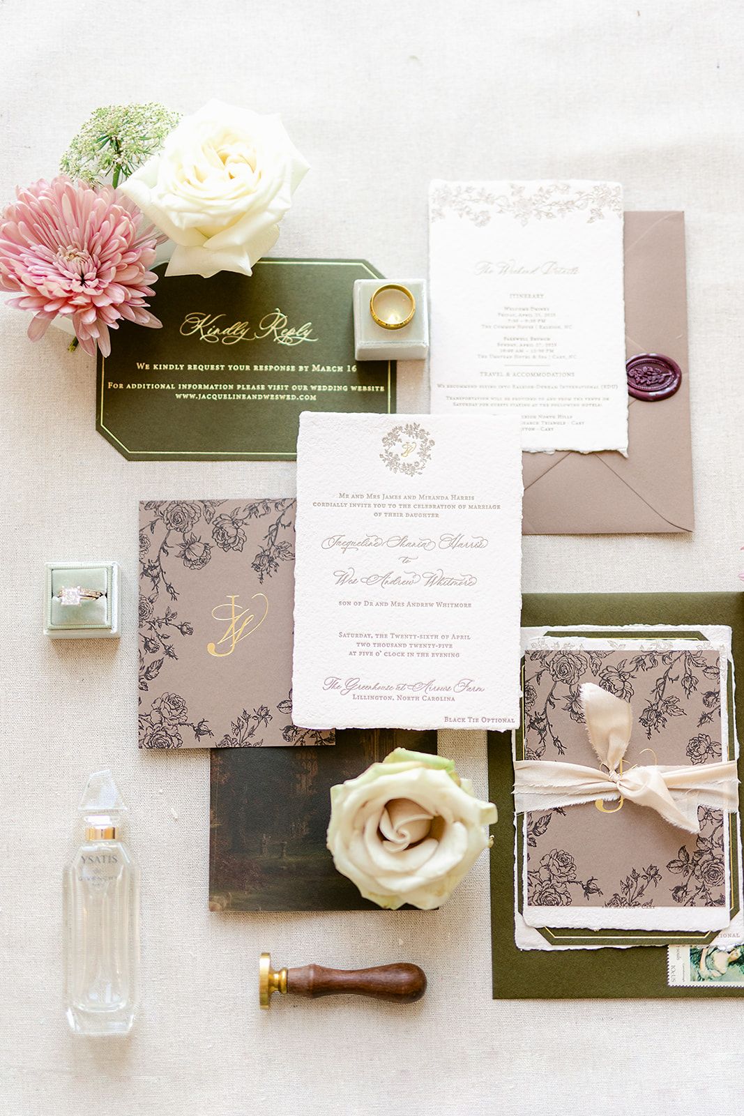 Elegant wedding invitation suite with floral designs in pink and gray tones featuring roses and calligraphy.