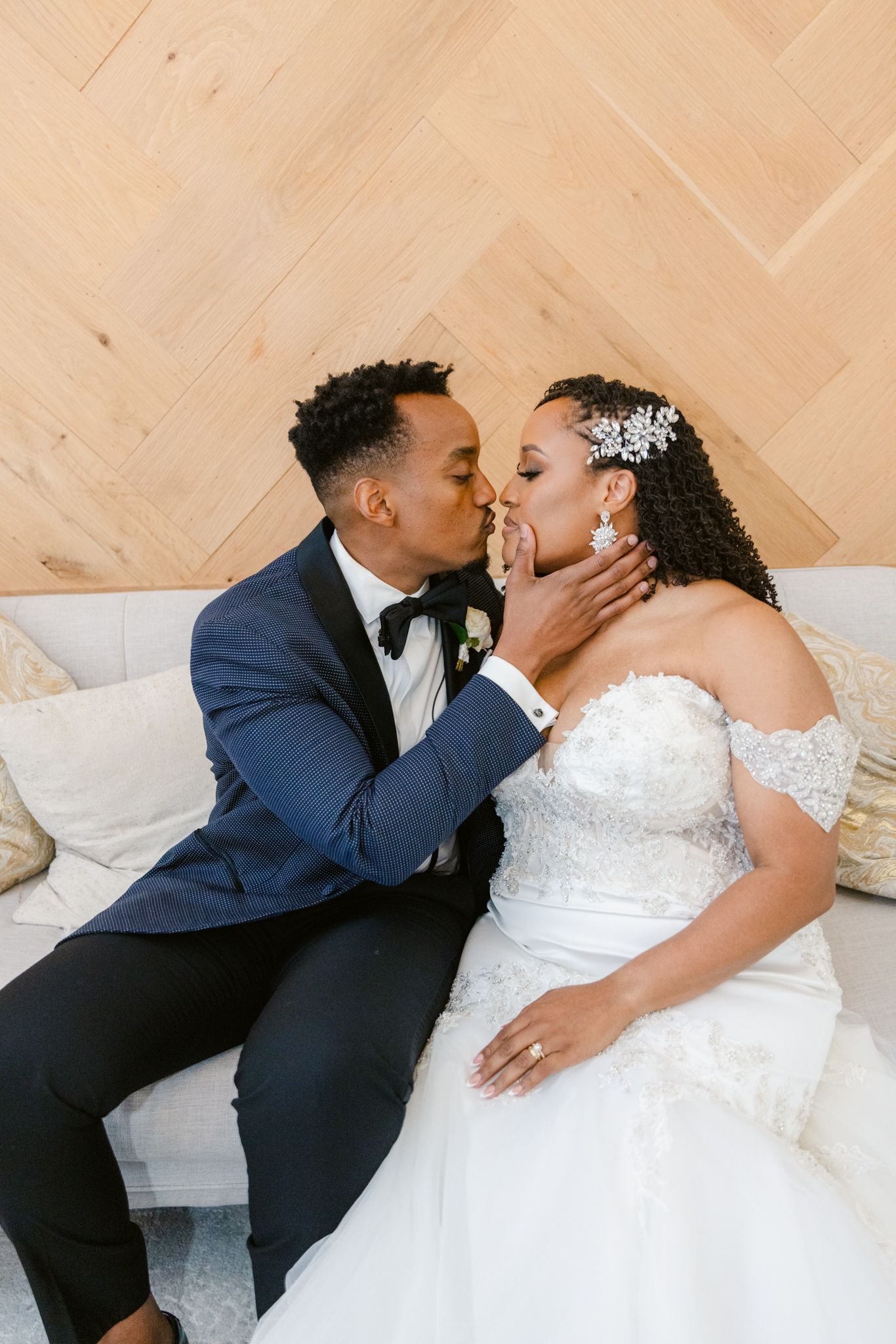 A romantic wedding photo sequence shows a couple in navy and white sharing tender kisses while seated together.
