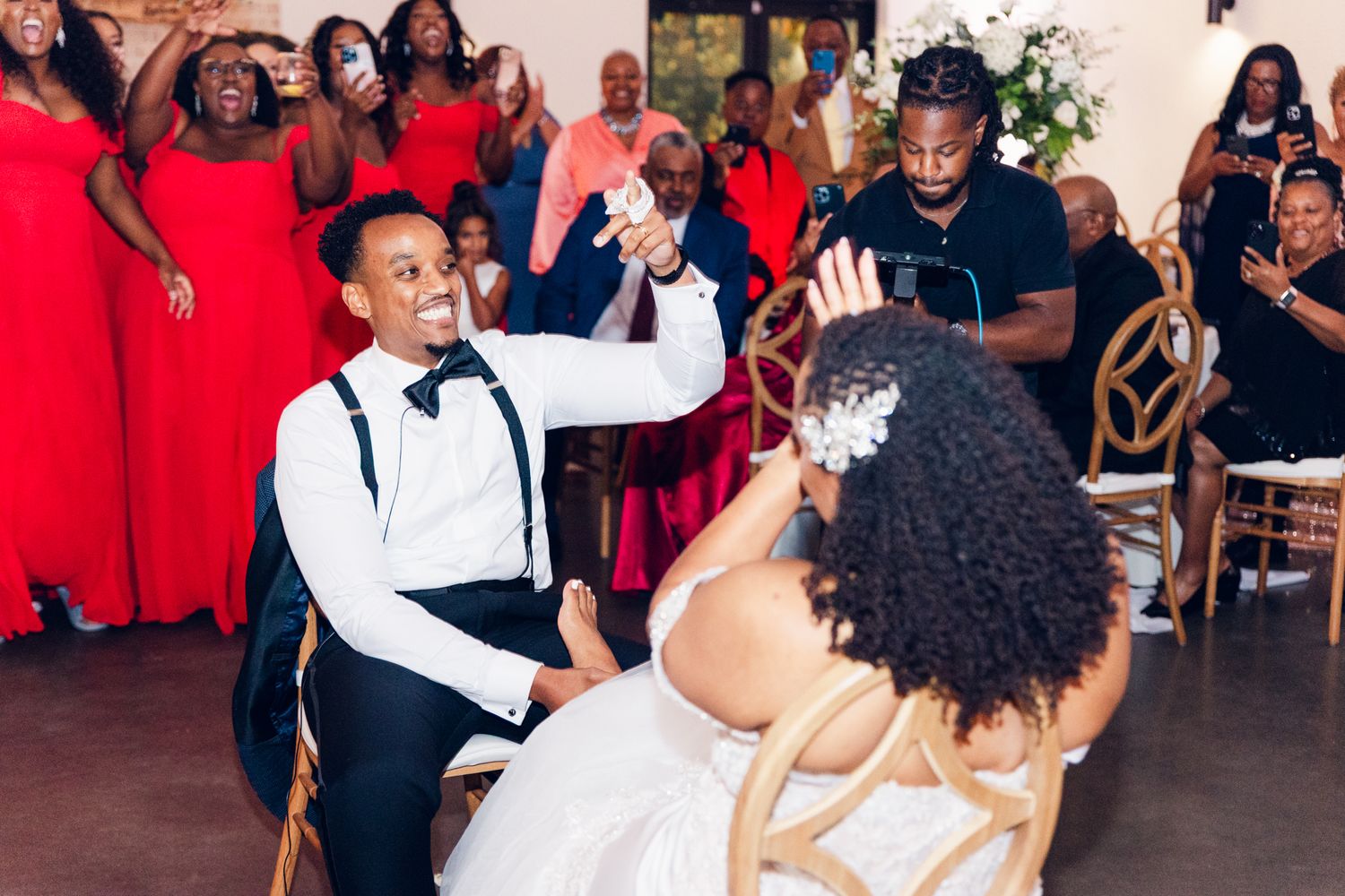 Guests enjoying themselves on the dance floor during a lively wedding reception.