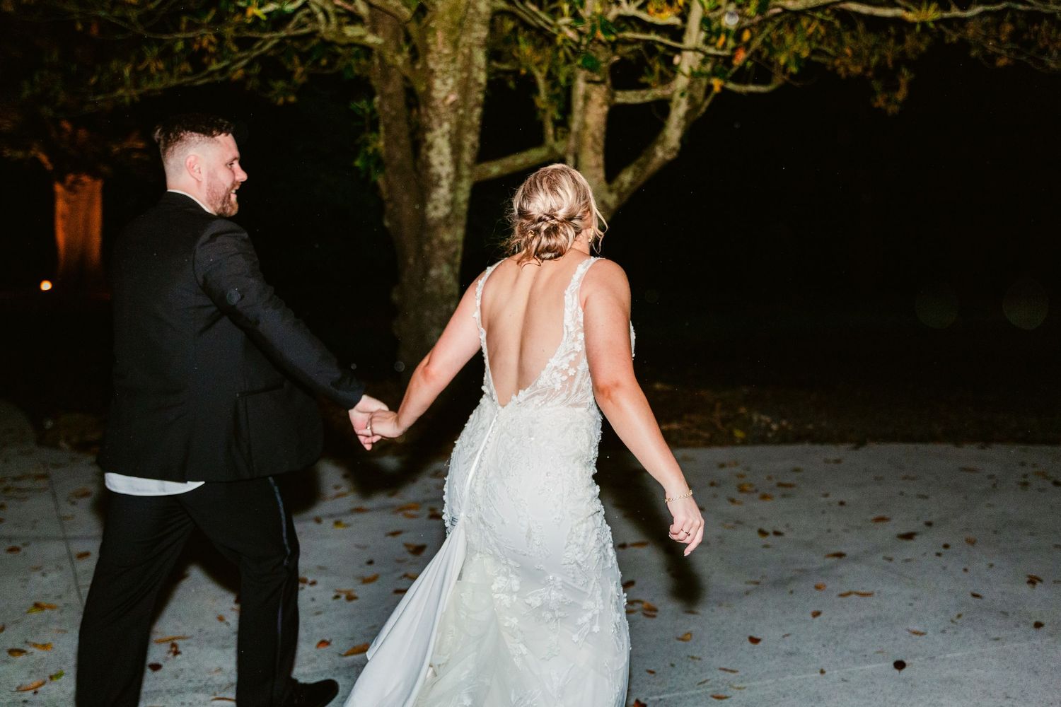A sequence of black and white photos showing a couple dancing in a wooded outdoor setting.