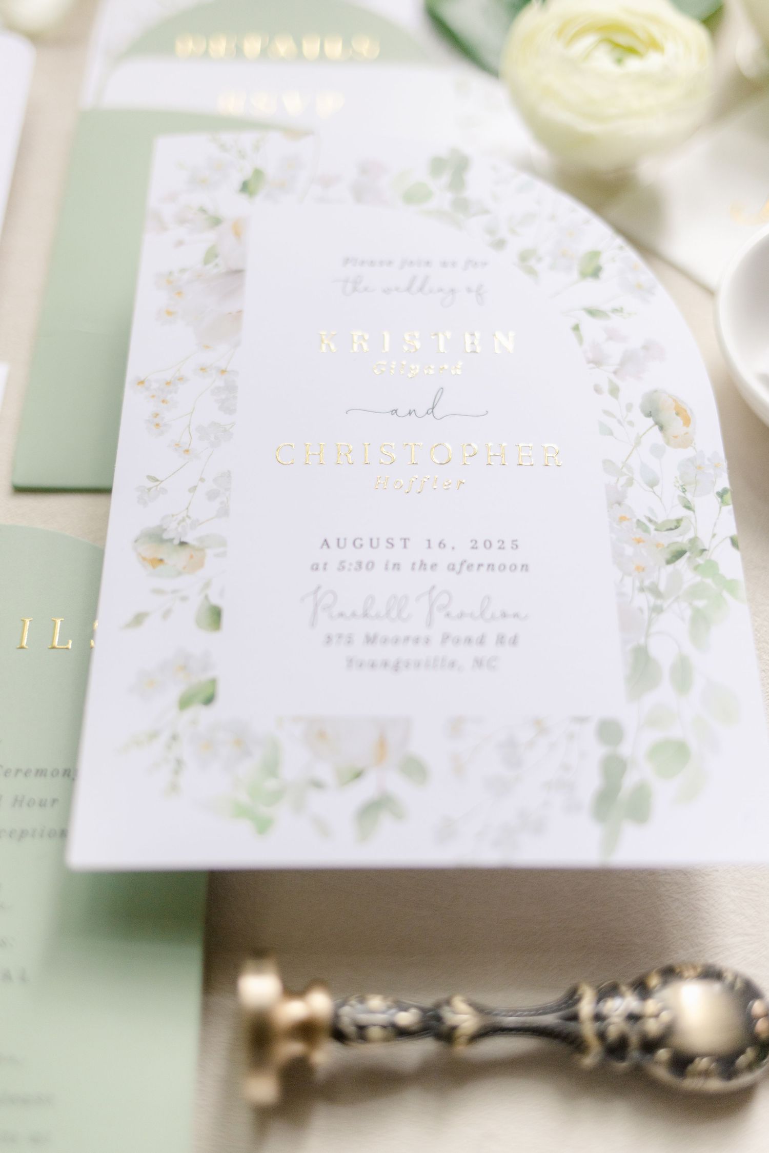 Elegant wedding stationery suite featuring sage green and white colors with delicate floral details and gold accents.