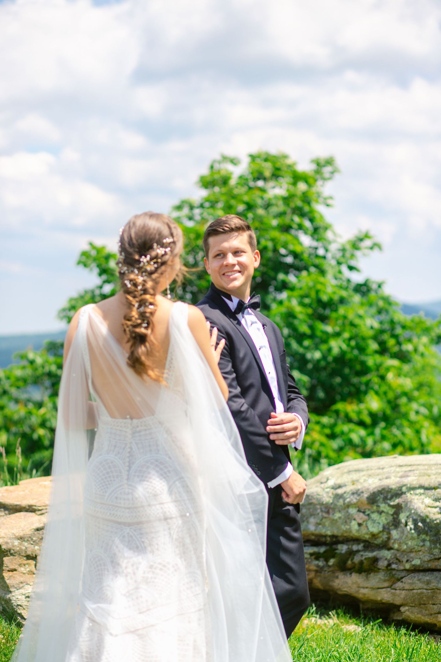 Scenic outdoor wedding moment with mountain views and natural landscape.
