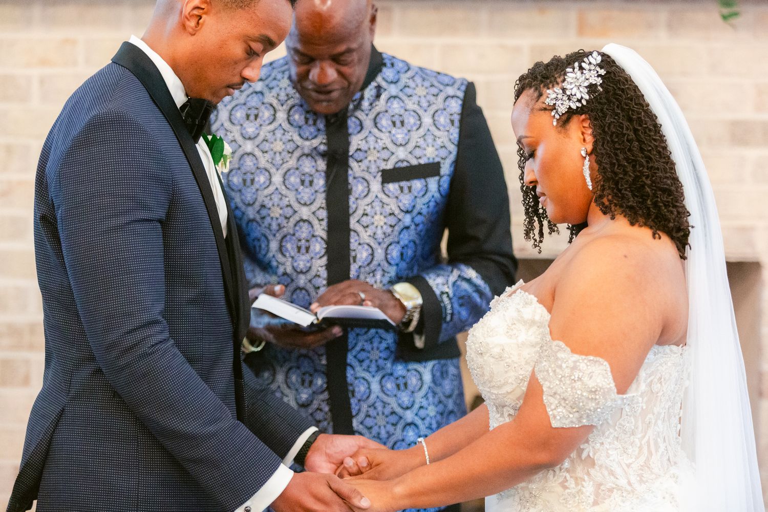An emotional moment during a wedding ceremony as the couple exchanges vows in front of guests.