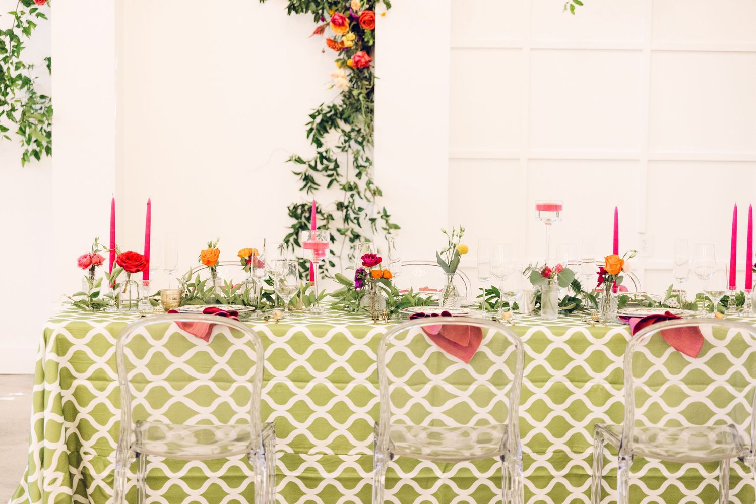 Wedding venue interior with floral decorations and geometric pattern details.