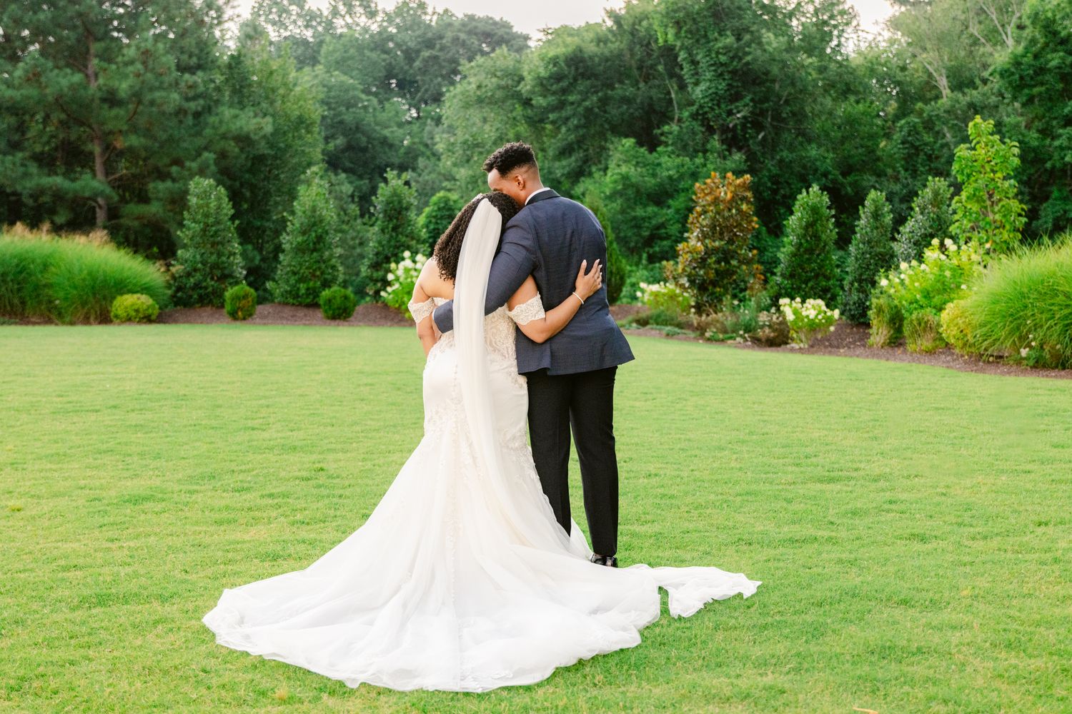 Romantic outdoor wedding photo sequence showing couple in formal attire walking through lush garden setting.