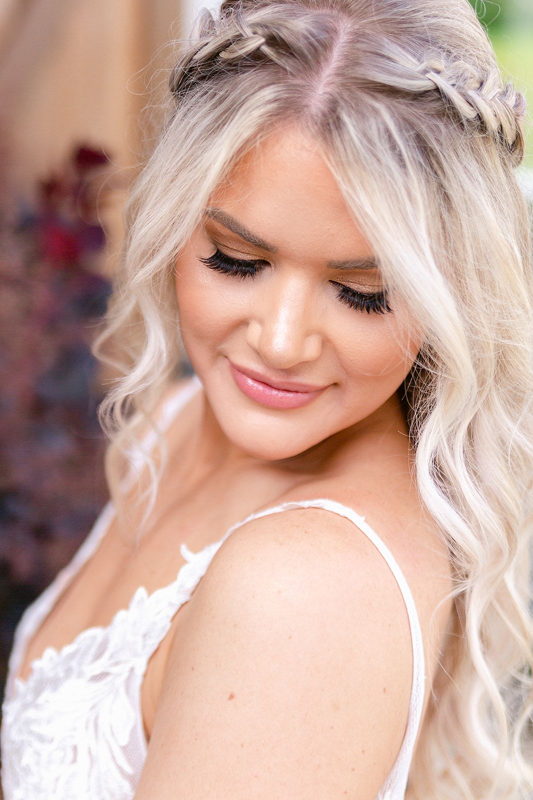 Ethereal bridal beauty look with soft blonde waves and natural makeup.