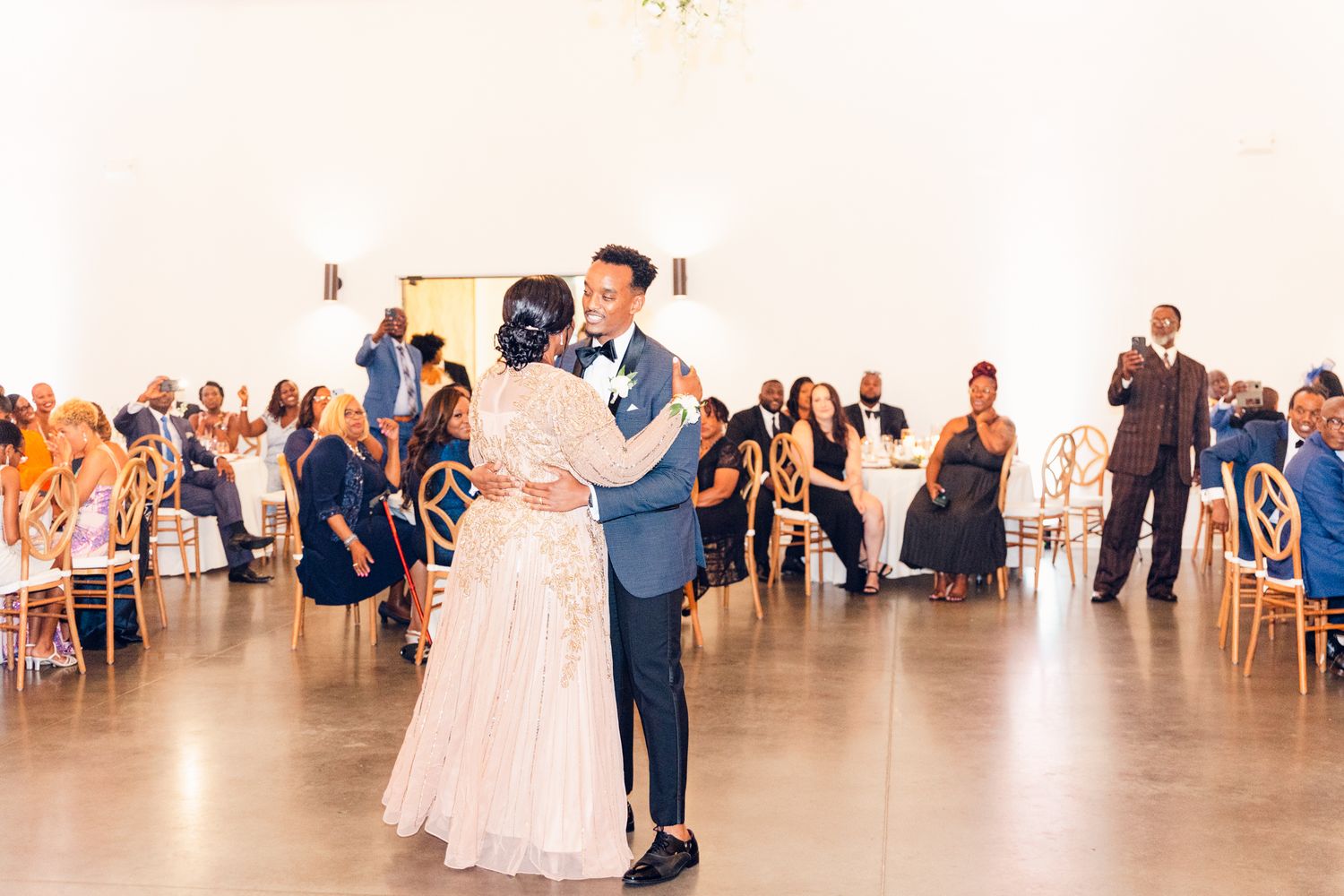 Wedding reception dance floor filled with guests enjoying the celebration.