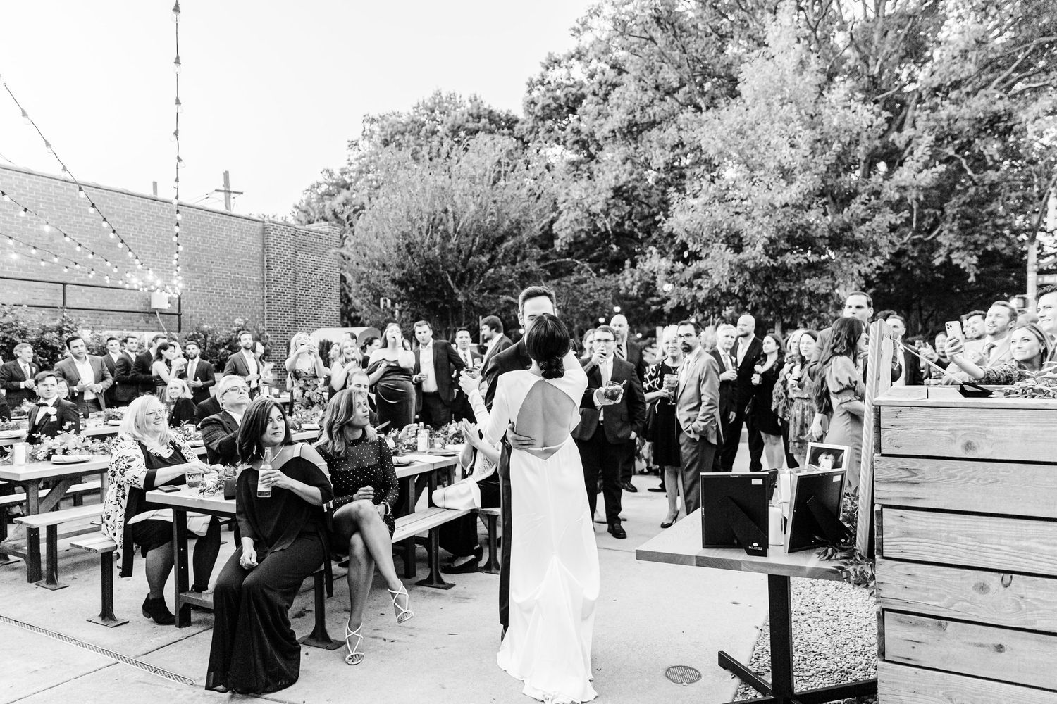 A black and white photo collage showing people gathered outdoors at what appears to be a social event or celebration.