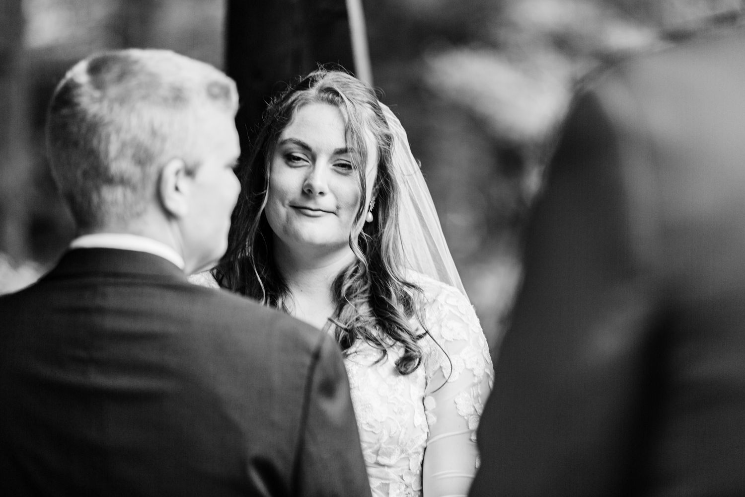 Black and white wedding photo collage showing intimate moments between newlyweds during their celebration.