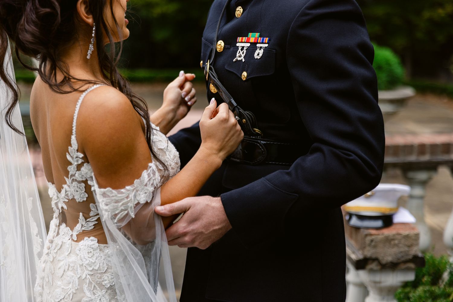 Bride and groom share intimate moments in a garden setting during their wedding photoshoot.