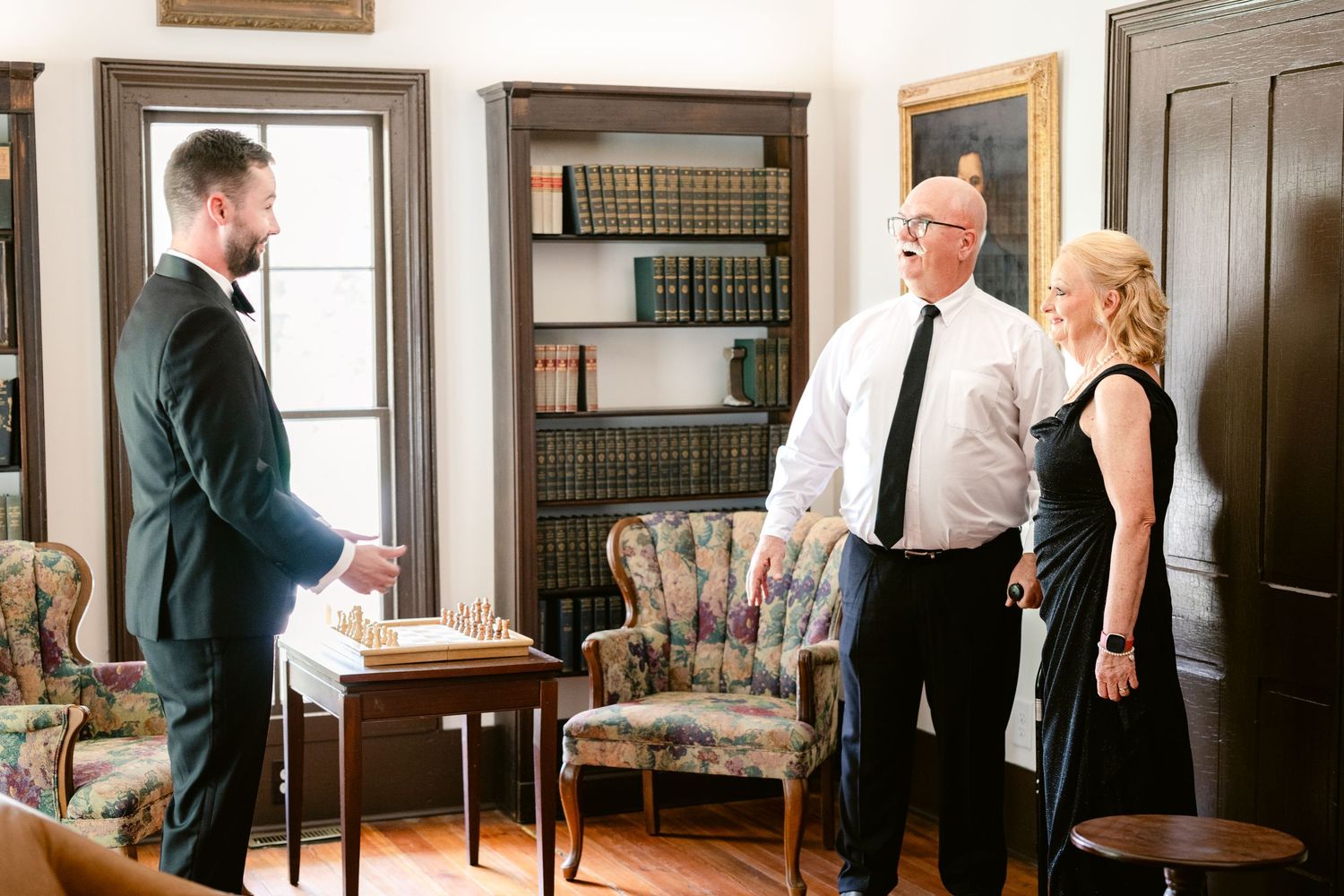 A sequence of five wedding photos showing intimate moments between a couple in a vintage indoor setting.